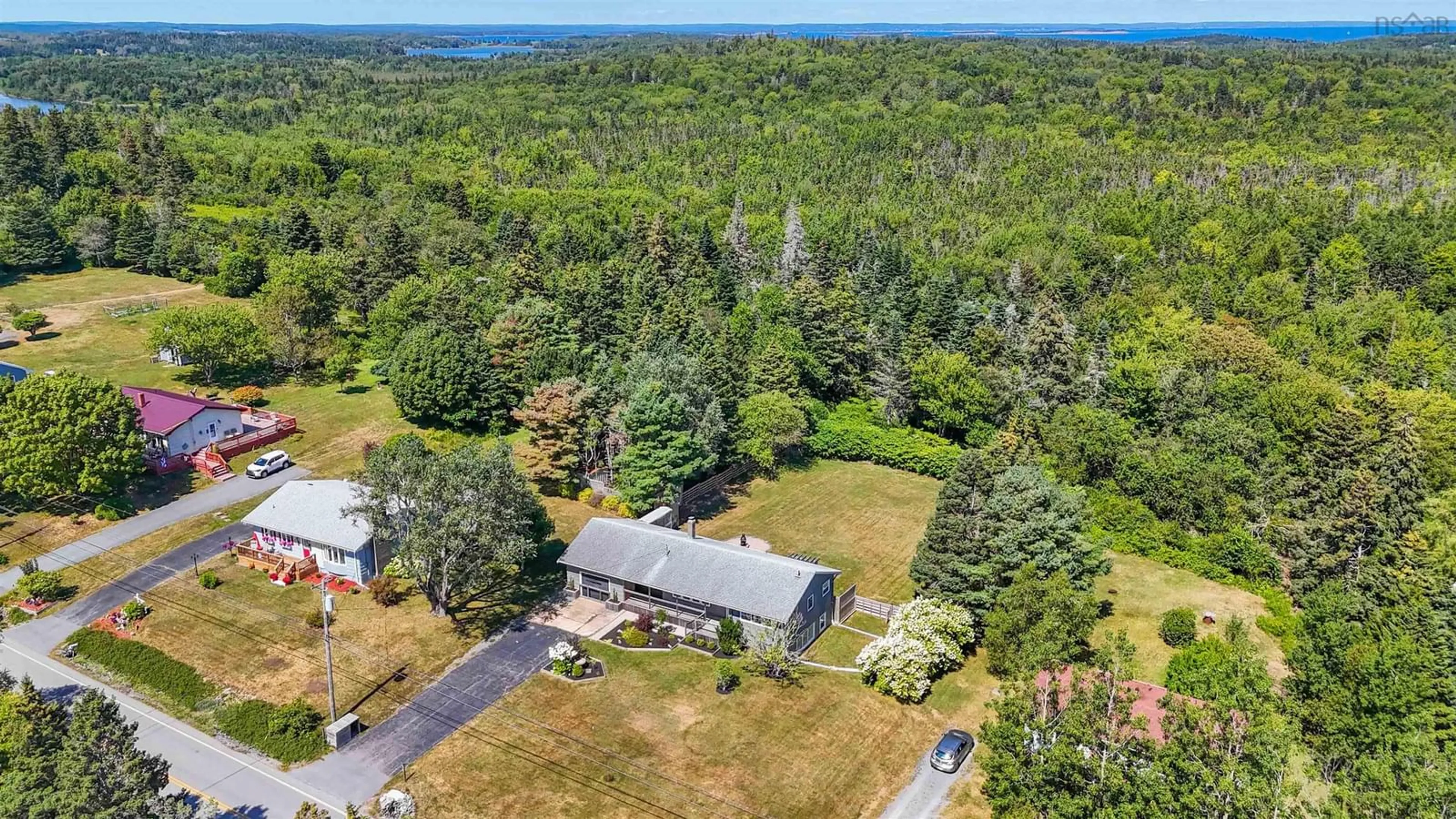 A pic from outside/outdoor area/front of a property/back of a property/a pic from drone, unknown for 911 Blue Rocks Rd, Garden Lots Nova Scotia B0J 2C0