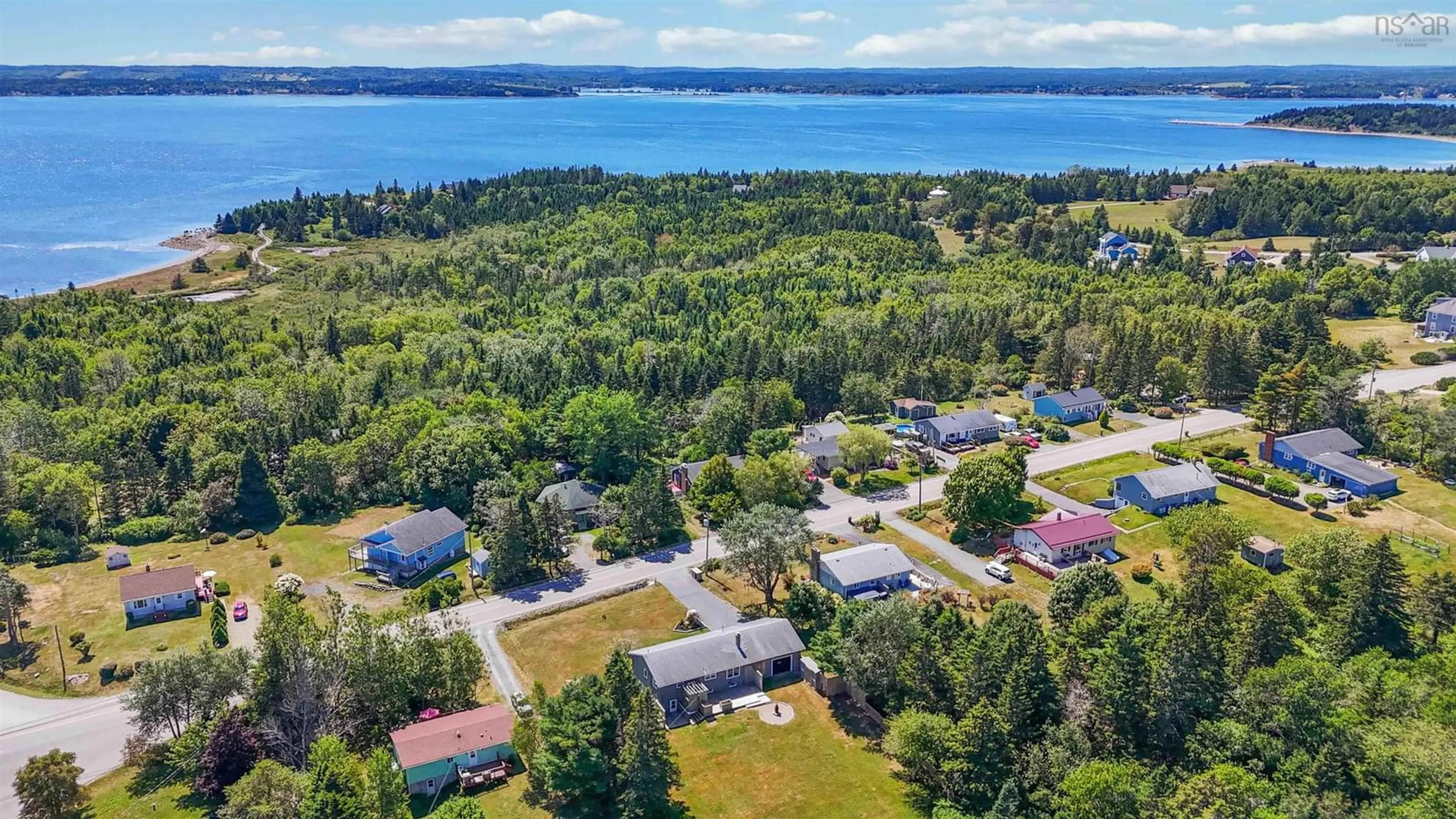 A pic from outside/outdoor area/front of a property/back of a property/a pic from drone, water/lake/river/ocean view for 911 Blue Rocks Rd, Garden Lots Nova Scotia B0J 2C0