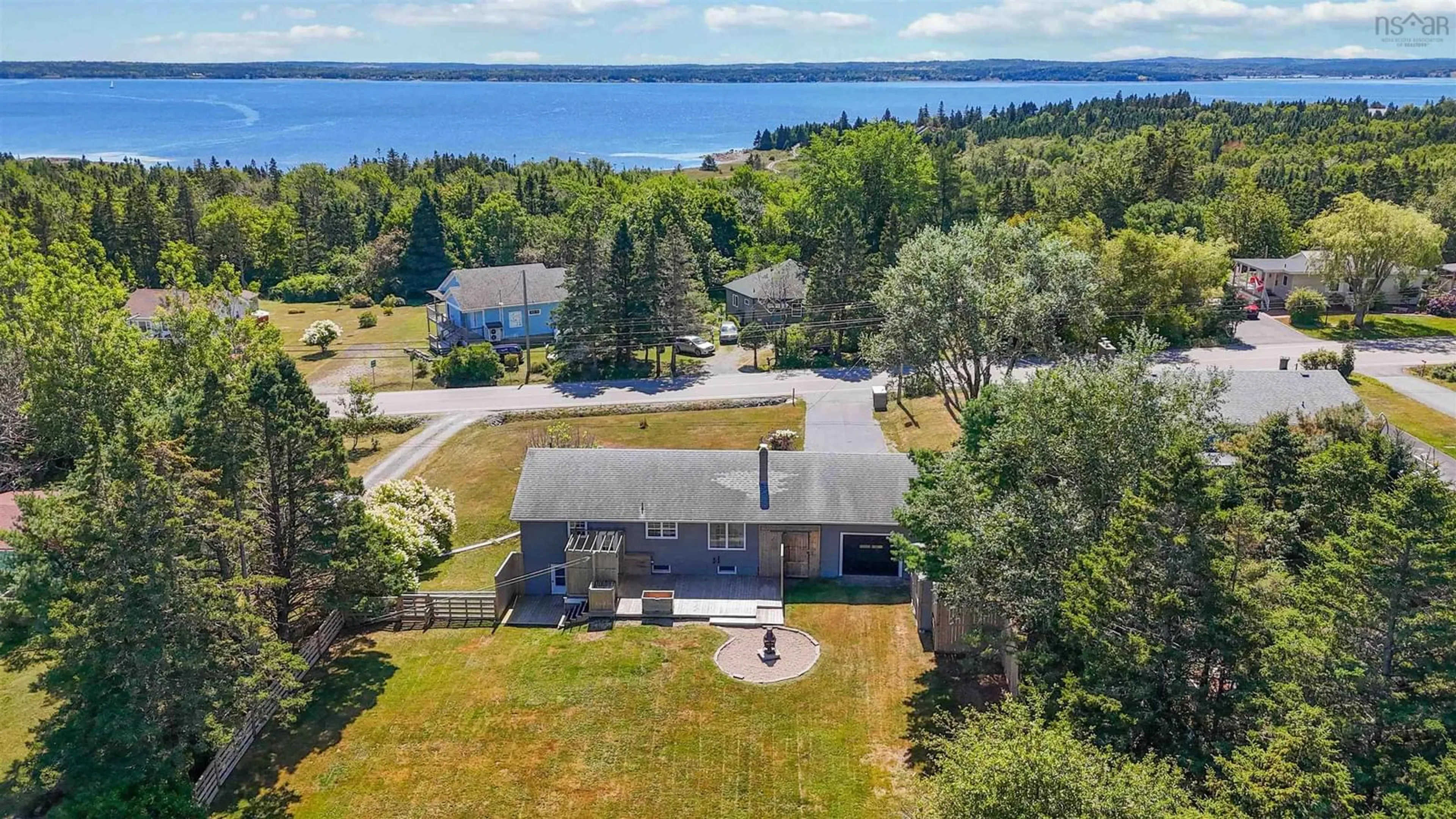 A pic from outside/outdoor area/front of a property/back of a property/a pic from drone, water/lake/river/ocean view for 911 Blue Rocks Rd, Garden Lots Nova Scotia B0J 2C0