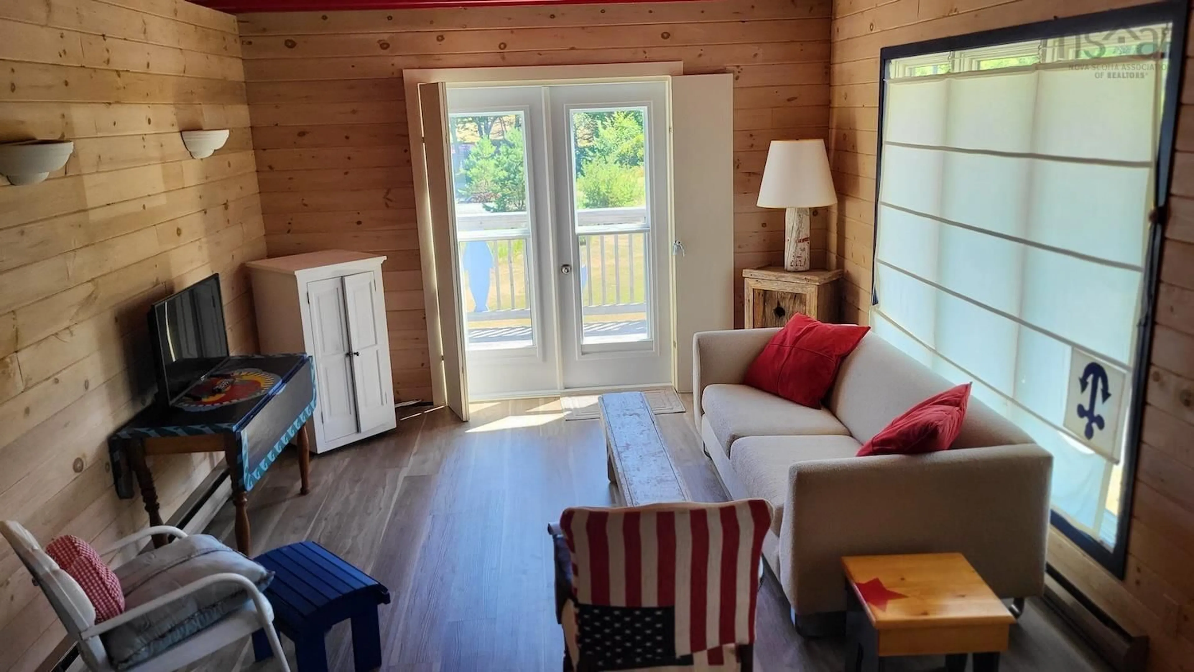 Living room with furniture, wood/laminate floor for 1915 Highway 331, Pleasantville Nova Scotia B0R 1G0