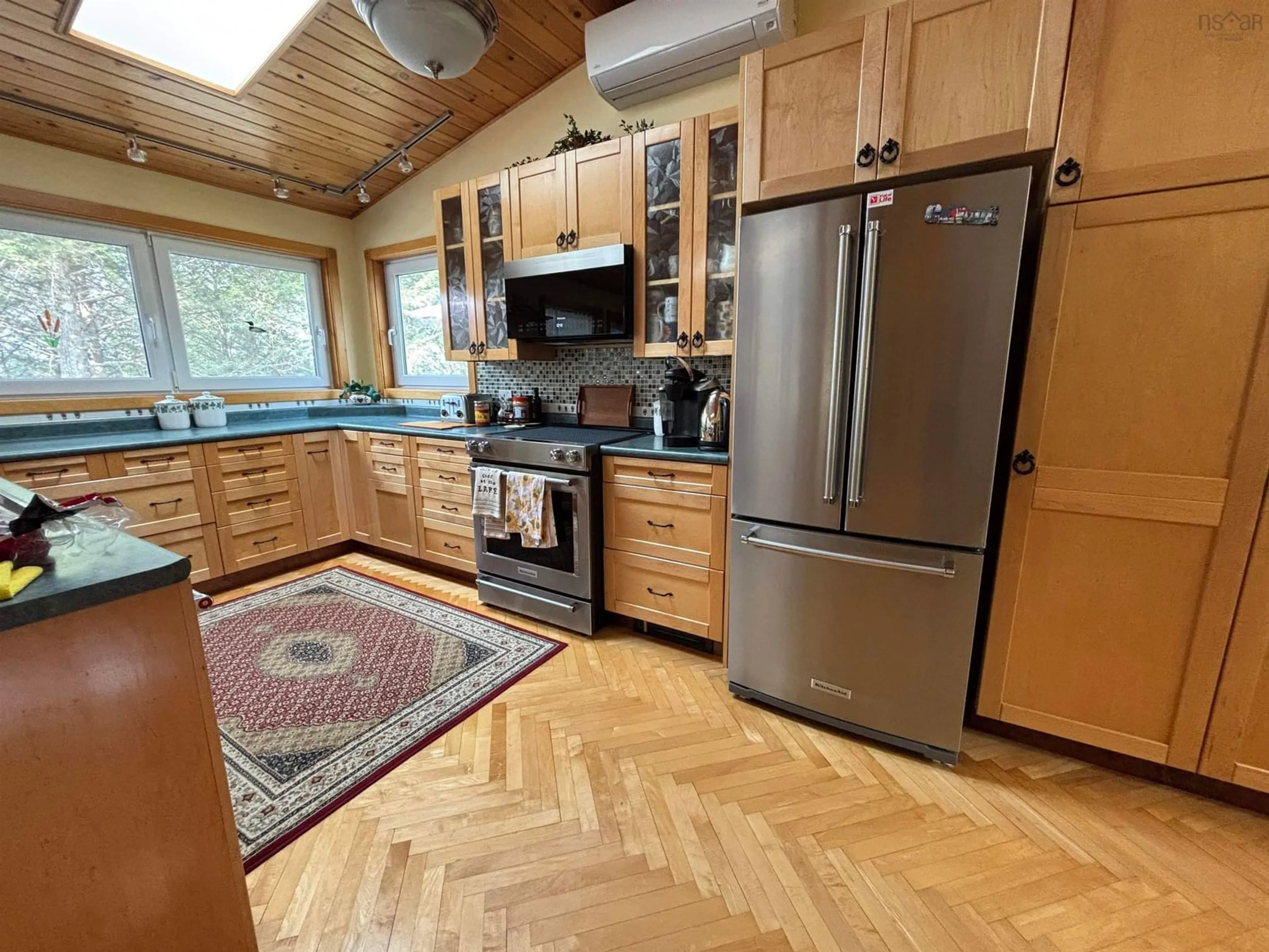 Open concept kitchen, wood/laminate floor for 69 Thumb Cap Point Rd, Labelle Nova Scotia B0T 1E0