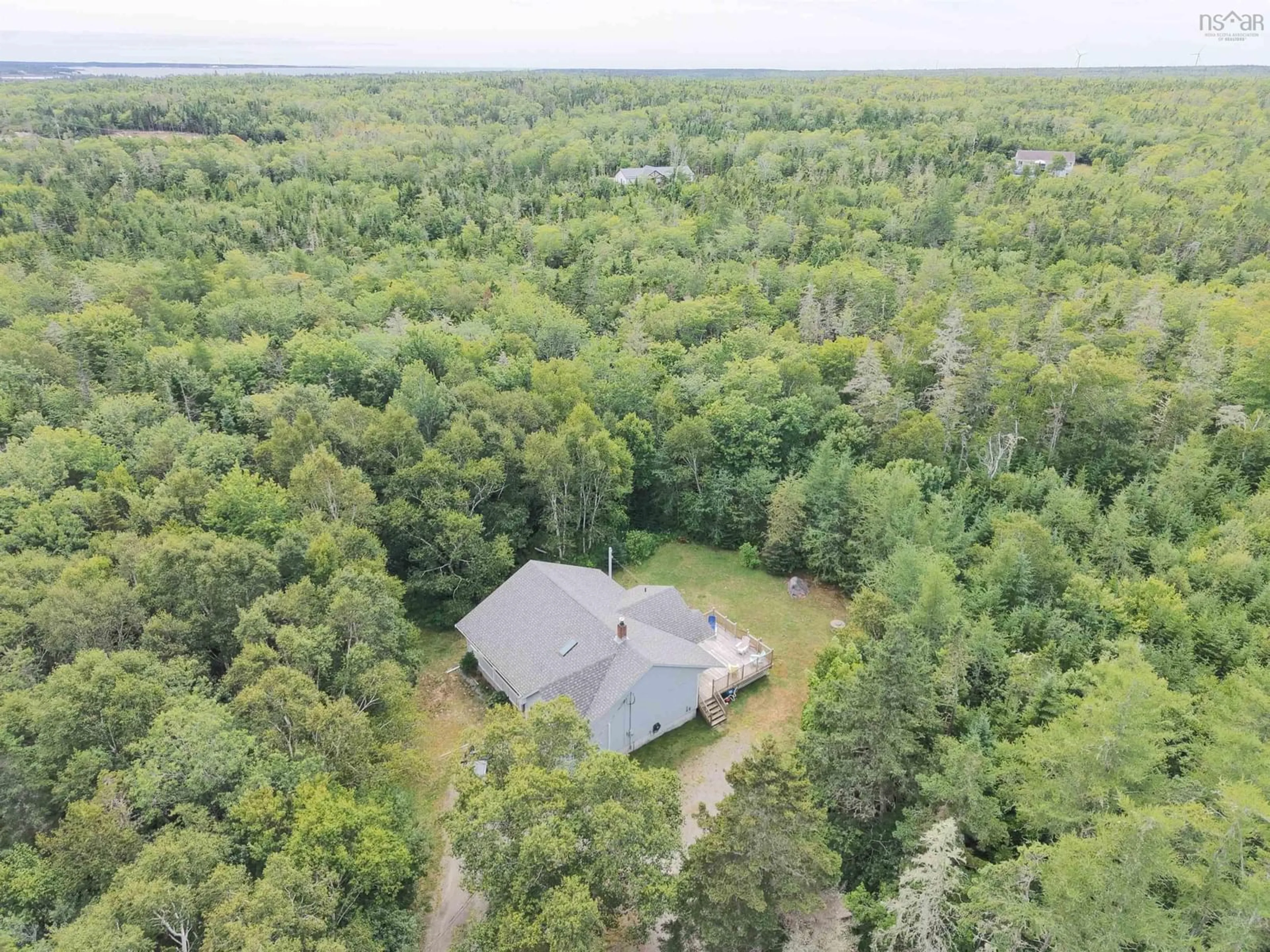 A pic from outside/outdoor area/front of a property/back of a property/a pic from drone, water/lake/river/ocean view for 23 Shannon Lane, Barrington Nova Scotia B0W 1G0