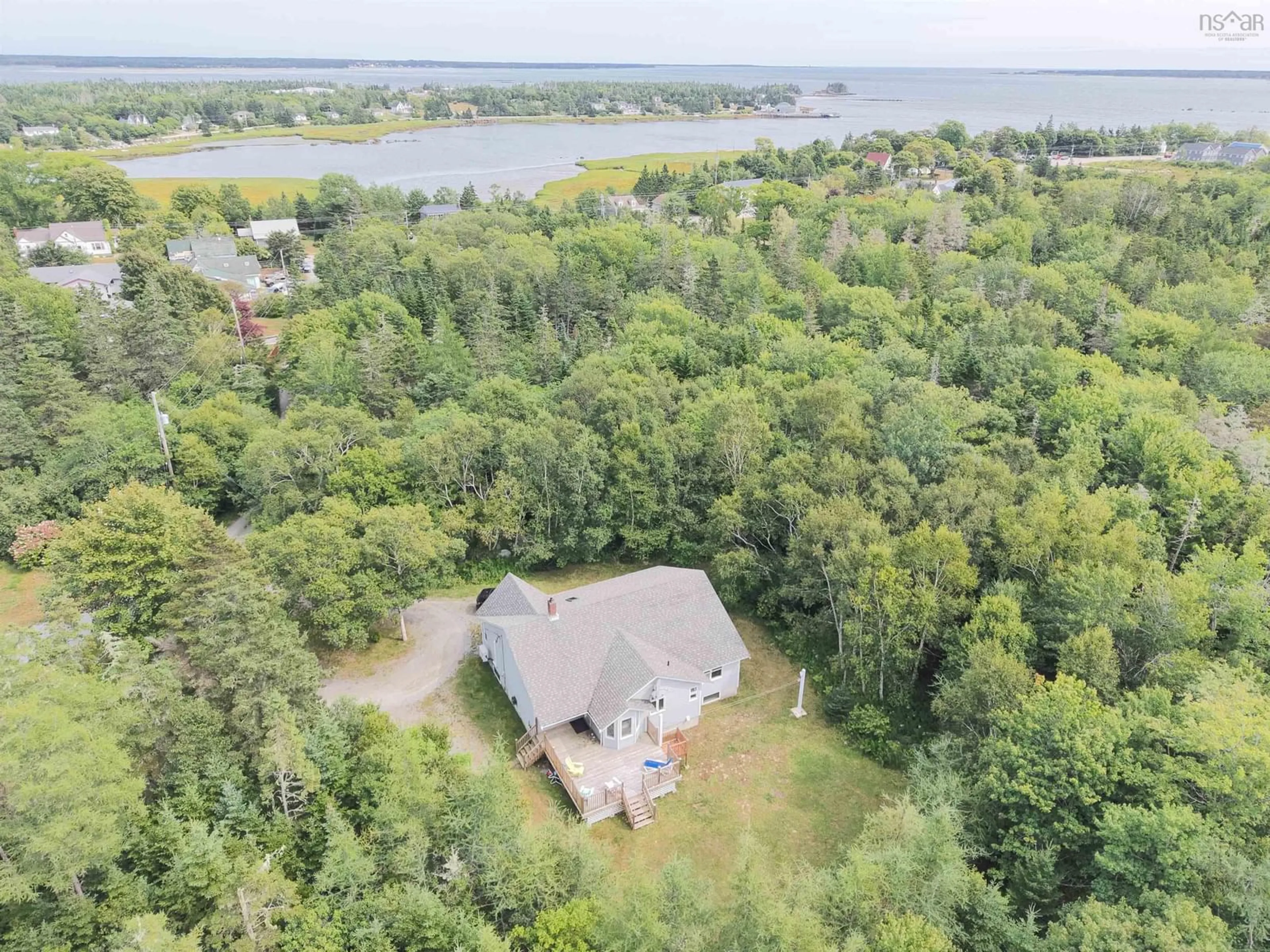 A pic from outside/outdoor area/front of a property/back of a property/a pic from drone, water/lake/river/ocean view for 23 Shannon Lane, Barrington Nova Scotia B0W 1G0