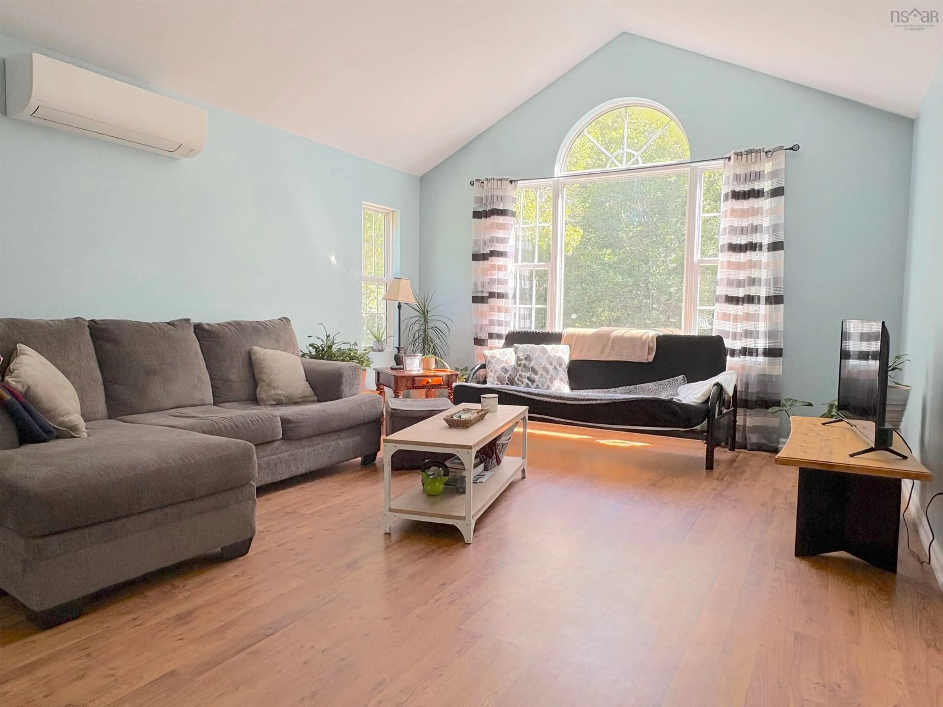 Living room with furniture, wood/laminate floor for 23 Shannon Lane, Barrington Nova Scotia B0W 1G0