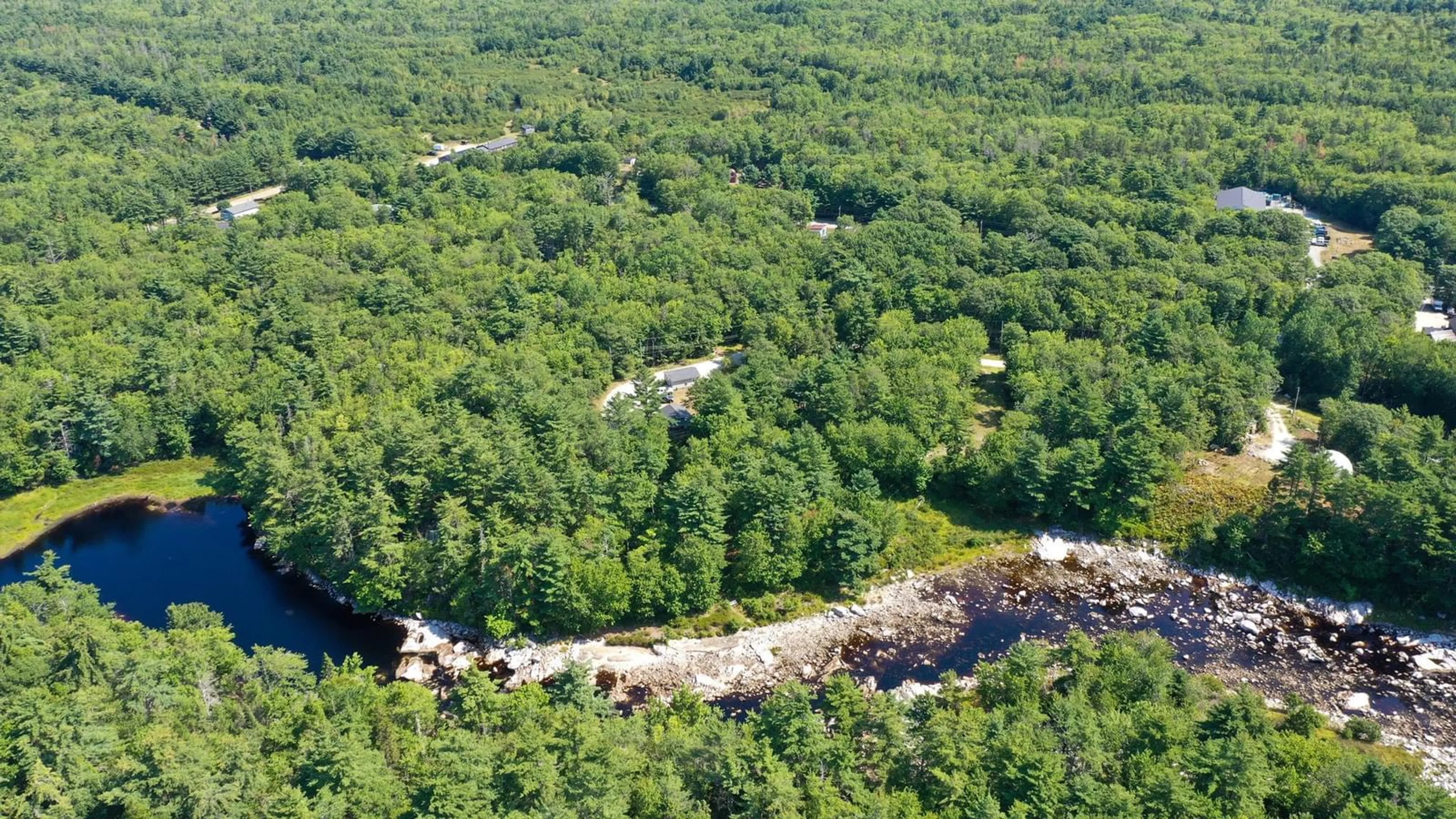 A pic from outside/outdoor area/front of a property/back of a property/a pic from drone, forest/trees view for 47 Riverview Dr, Lower Ohio Nova Scotia B0T 1W0