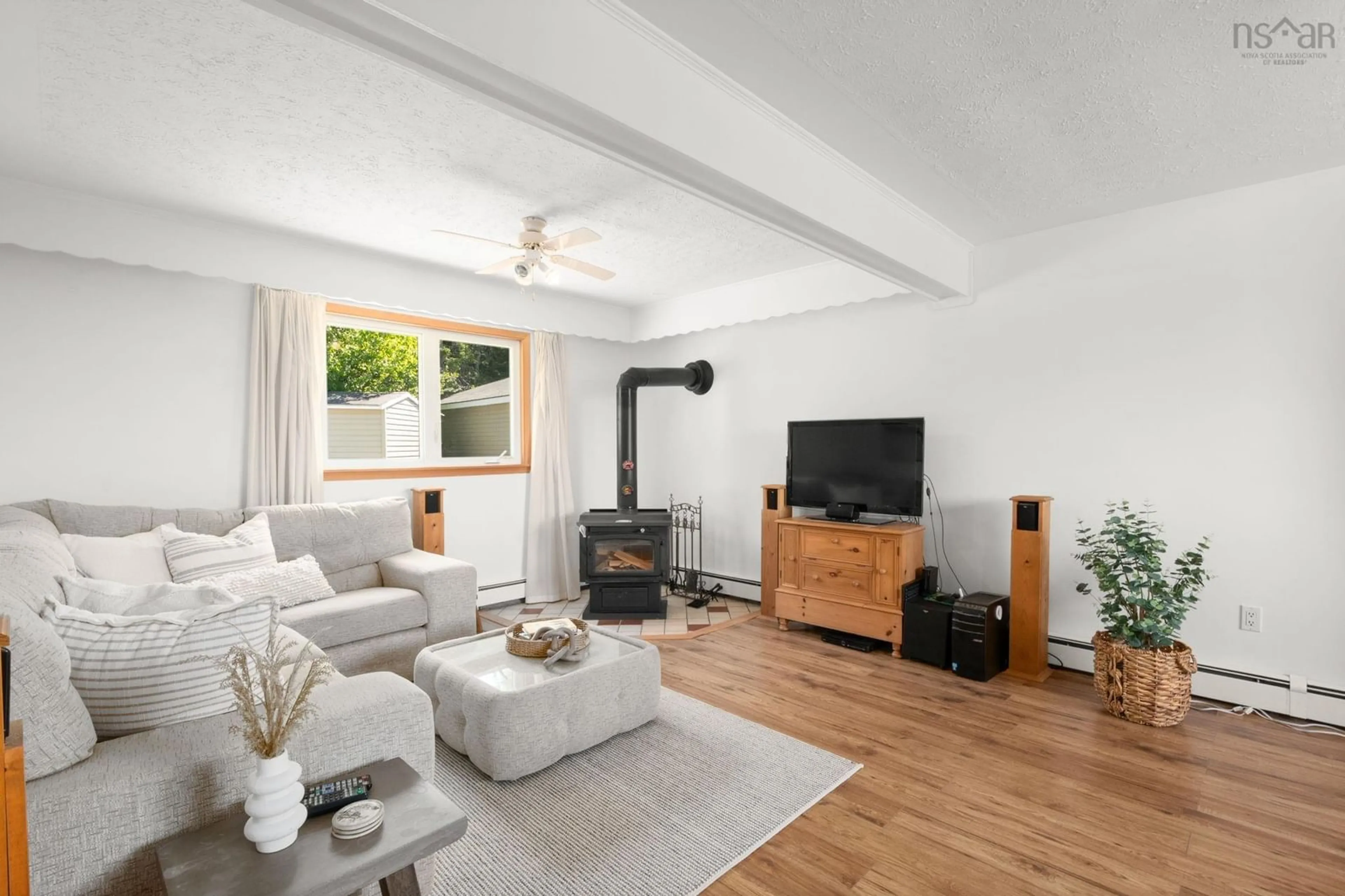 Living room with furniture, wood/laminate floor for 369 Sambro Creek Rd, Sambro Creek Nova Scotia B3V 1E9