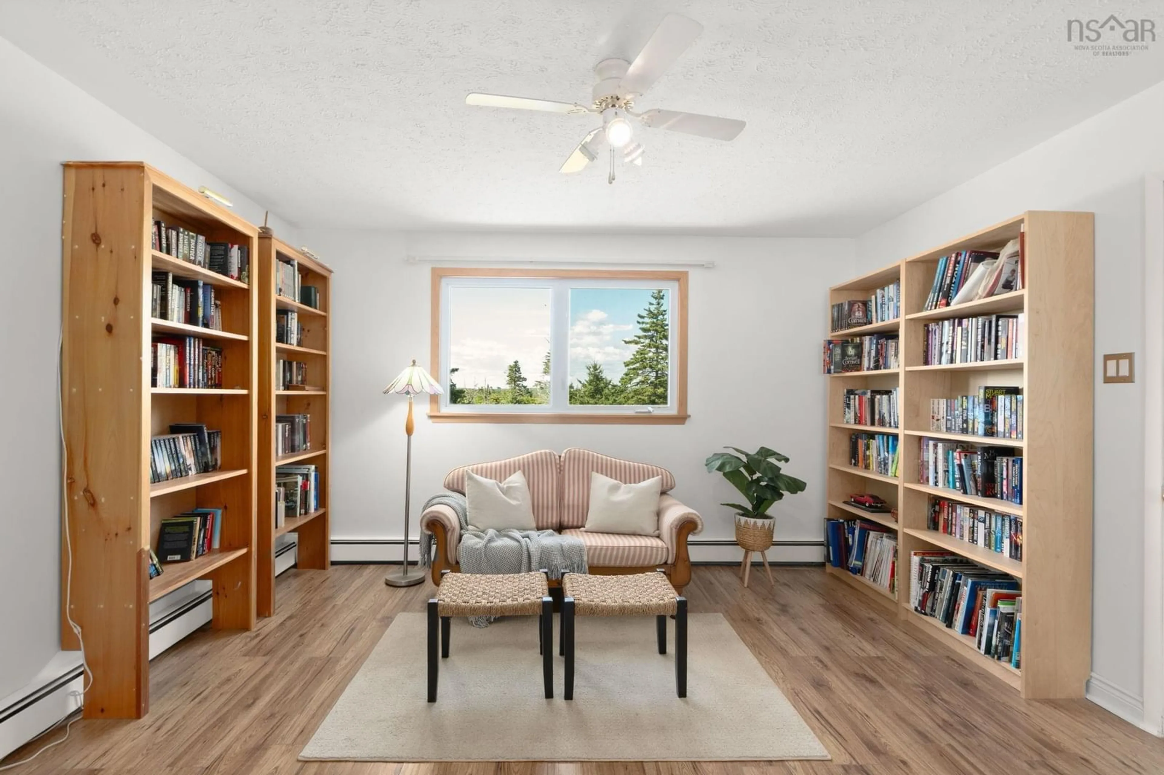 Living room with furniture, wood/laminate floor for 369 Sambro Creek Rd, Sambro Creek Nova Scotia B3V 1E9