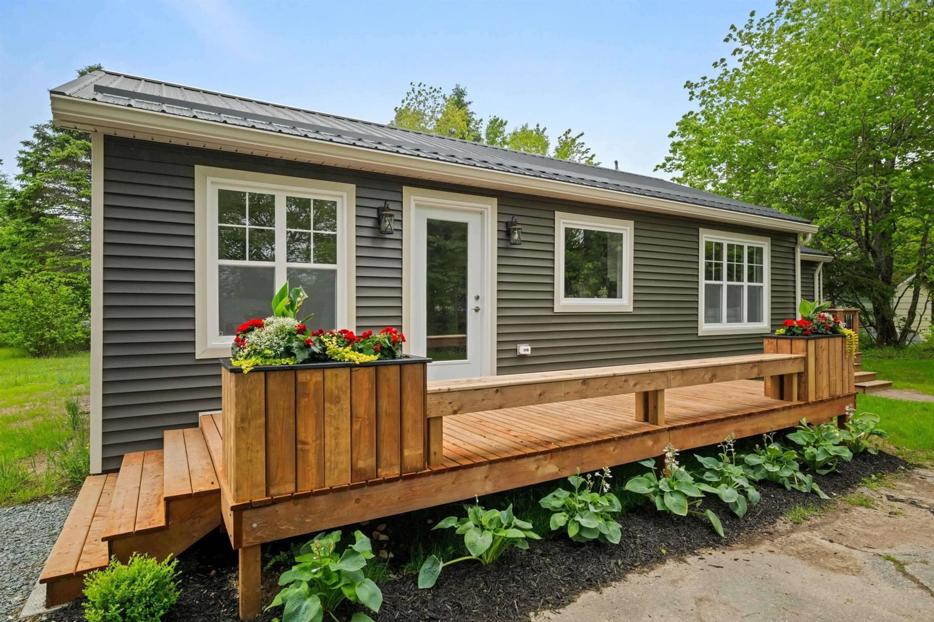 Home with vinyl exterior material, street for 7 Daylily Lane, Lake Charlotte Nova Scotia B0J 1L0