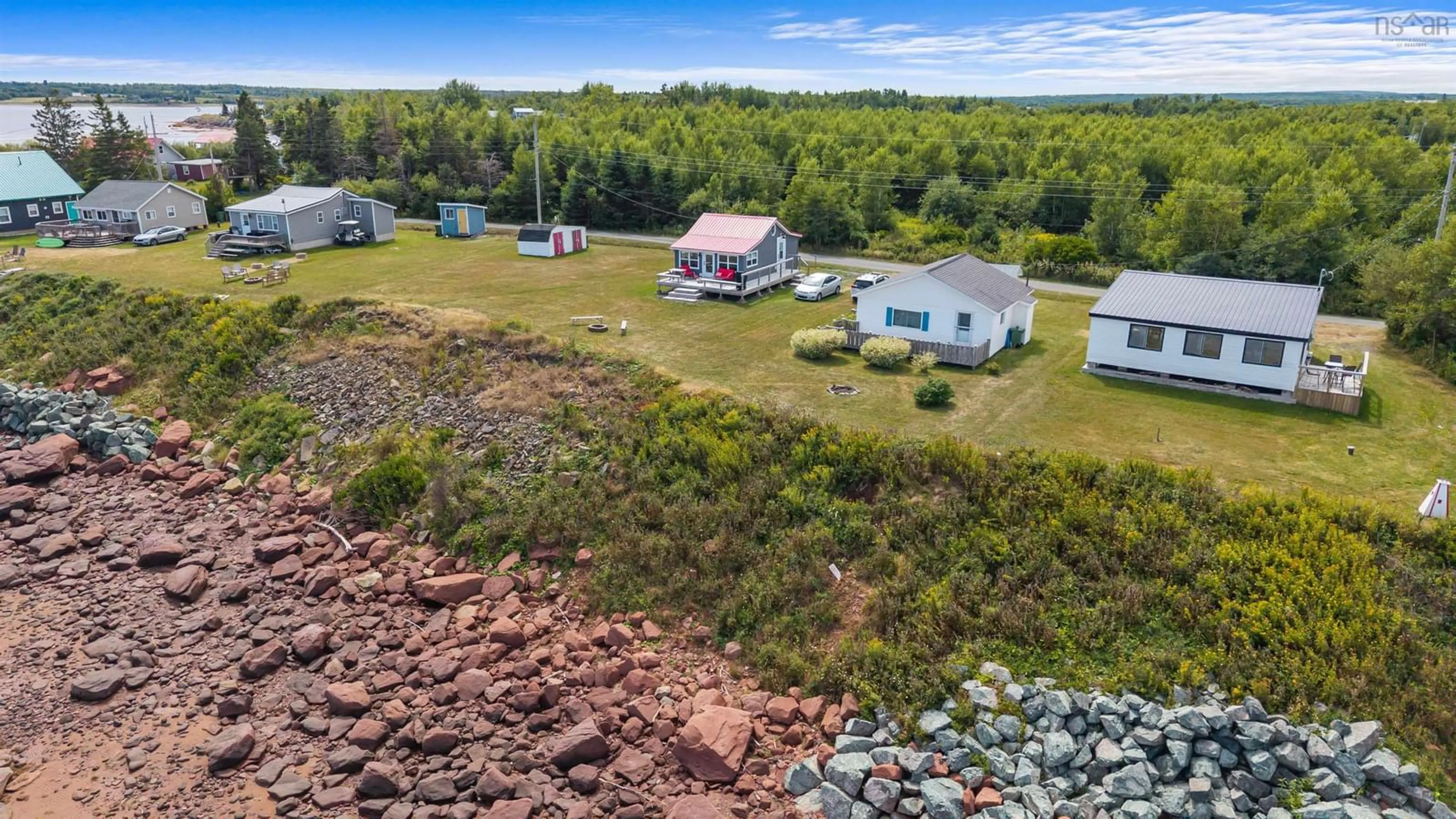 A pic from outside/outdoor area/front of a property/back of a property/a pic from drone, water/lake/river/ocean view for 130 Beach Rd, Port Howe Nova Scotia B0K 1L0