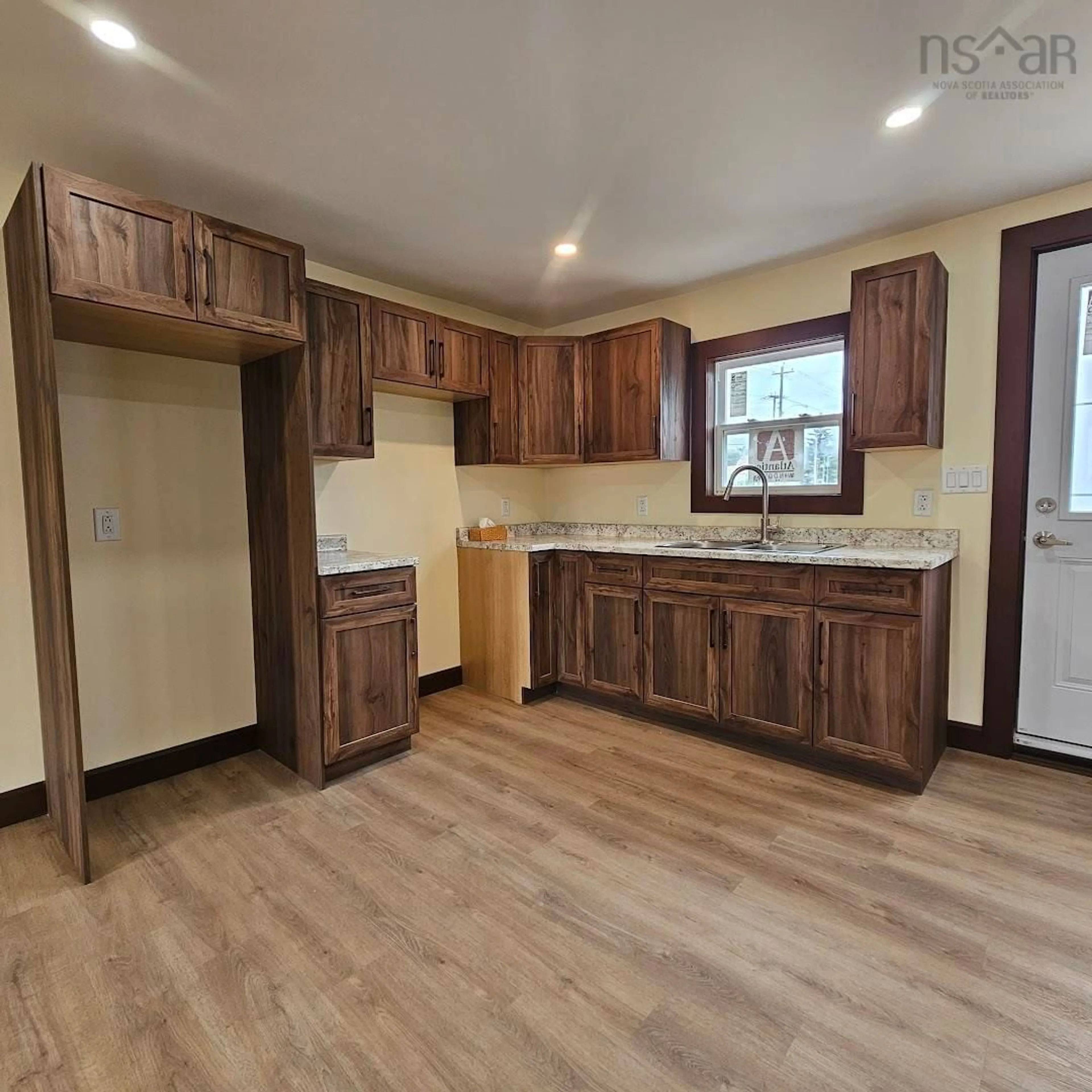 Open concept kitchen, wood/laminate floor for 382 Chestnut Dr, Sydney Nova Scotia B1P 4Y8