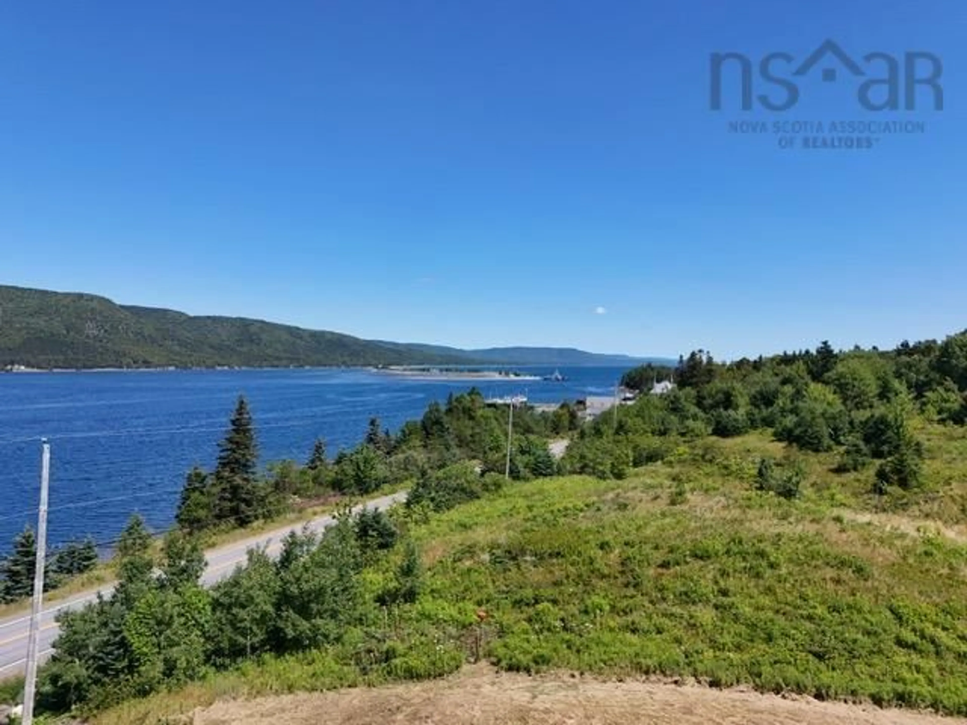 A pic from outside/outdoor area/front of a property/back of a property/a pic from drone, water/lake/river/ocean view for 11 Kellys Lane, Englishtown Nova Scotia B0E 1B0