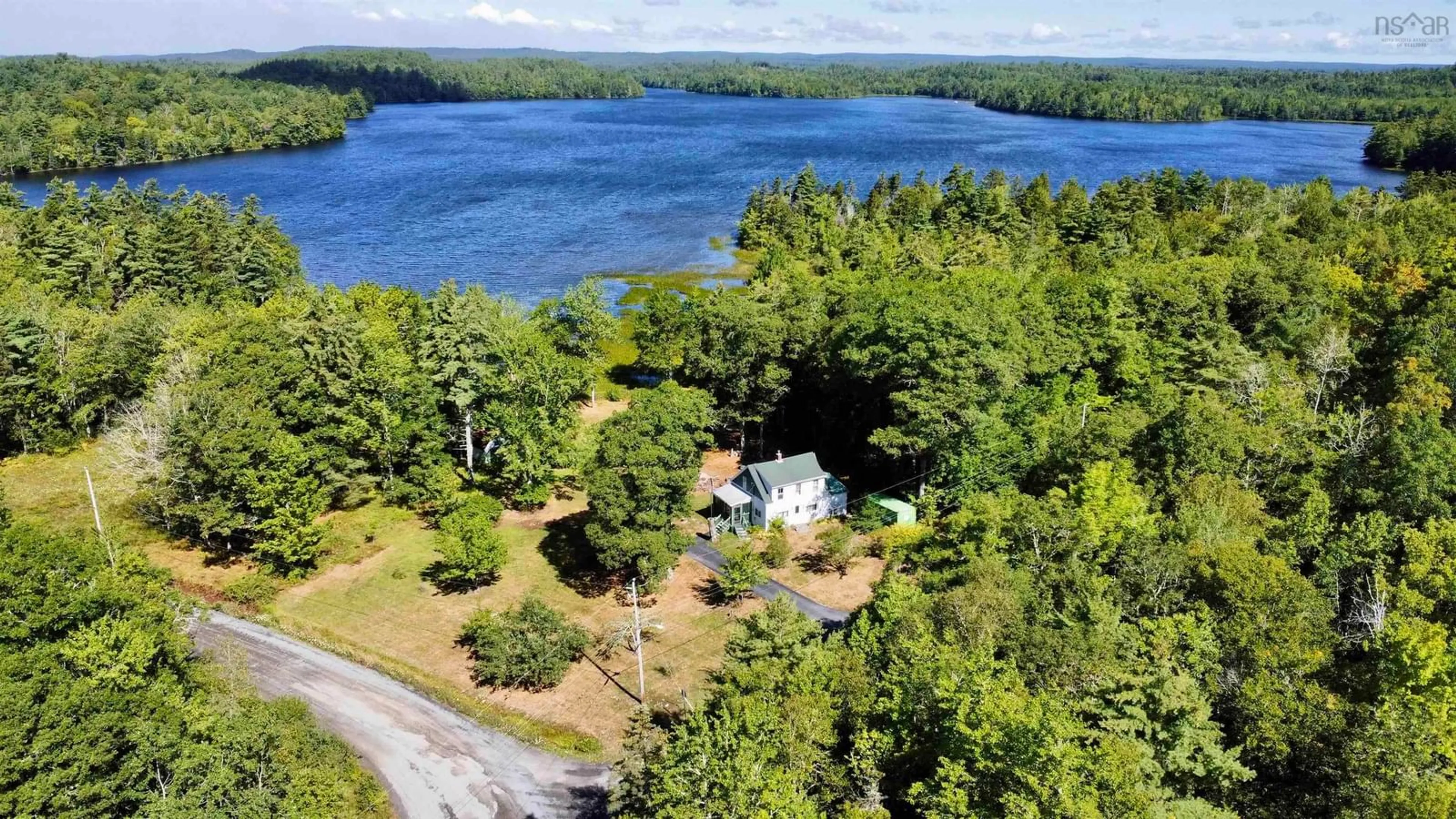 A pic from outside/outdoor area/front of a property/back of a property/a pic from drone, water/lake/river/ocean view for 9 Silver Rd, North Brookfield Nova Scotia B0T 1X0