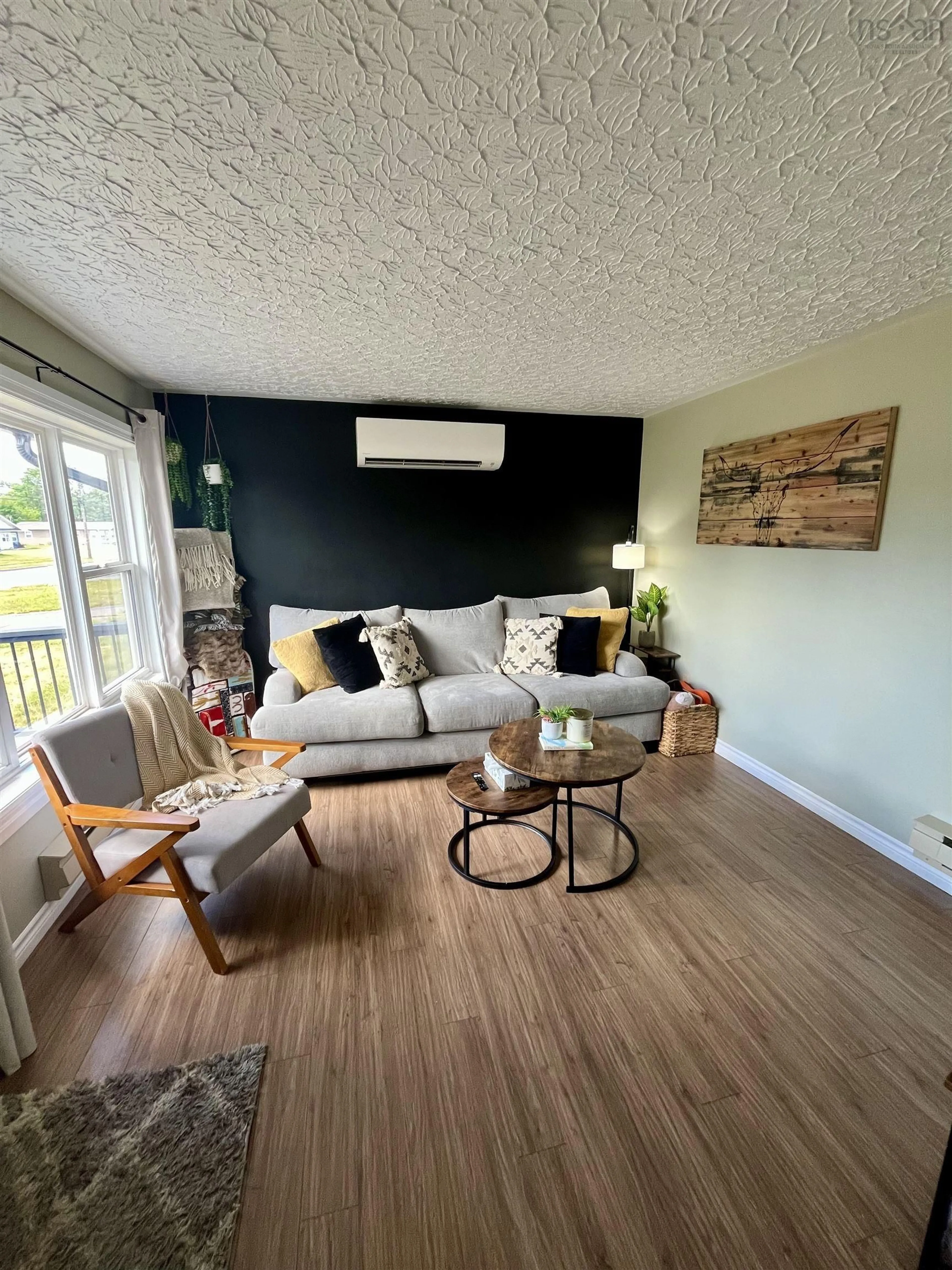 Living room with furniture, wood/laminate floor for 72 Acadia Ave, Stellarton Nova Scotia B0K 1S0