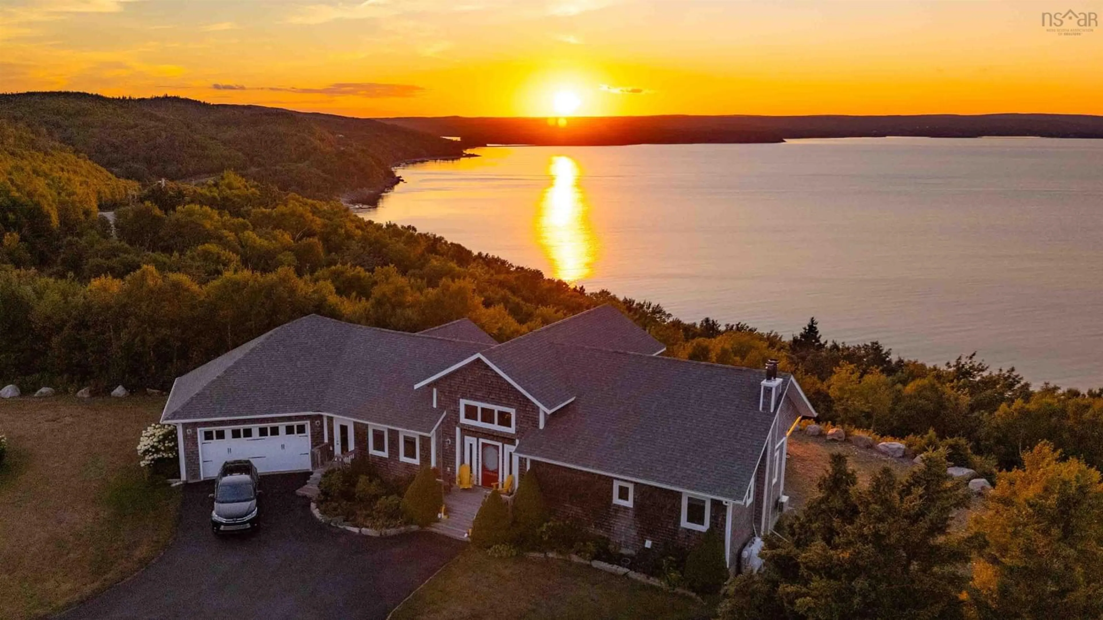 A pic from outside/outdoor area/front of a property/back of a property/a pic from drone, water/lake/river/ocean view for 8194 Highway 16, Dorts Cove Nova Scotia B0H 1N0
