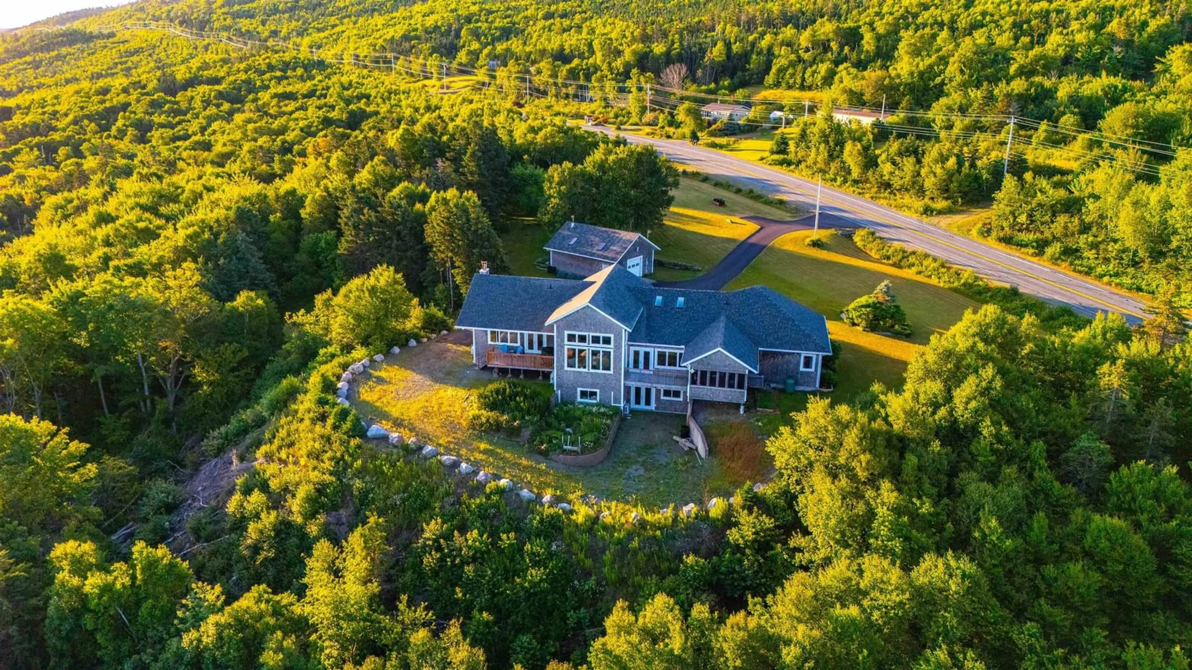 A pic from outside/outdoor area/front of a property/back of a property/a pic from drone, mountain view for 8194 Highway 16, Dorts Cove Nova Scotia B0H 1N0