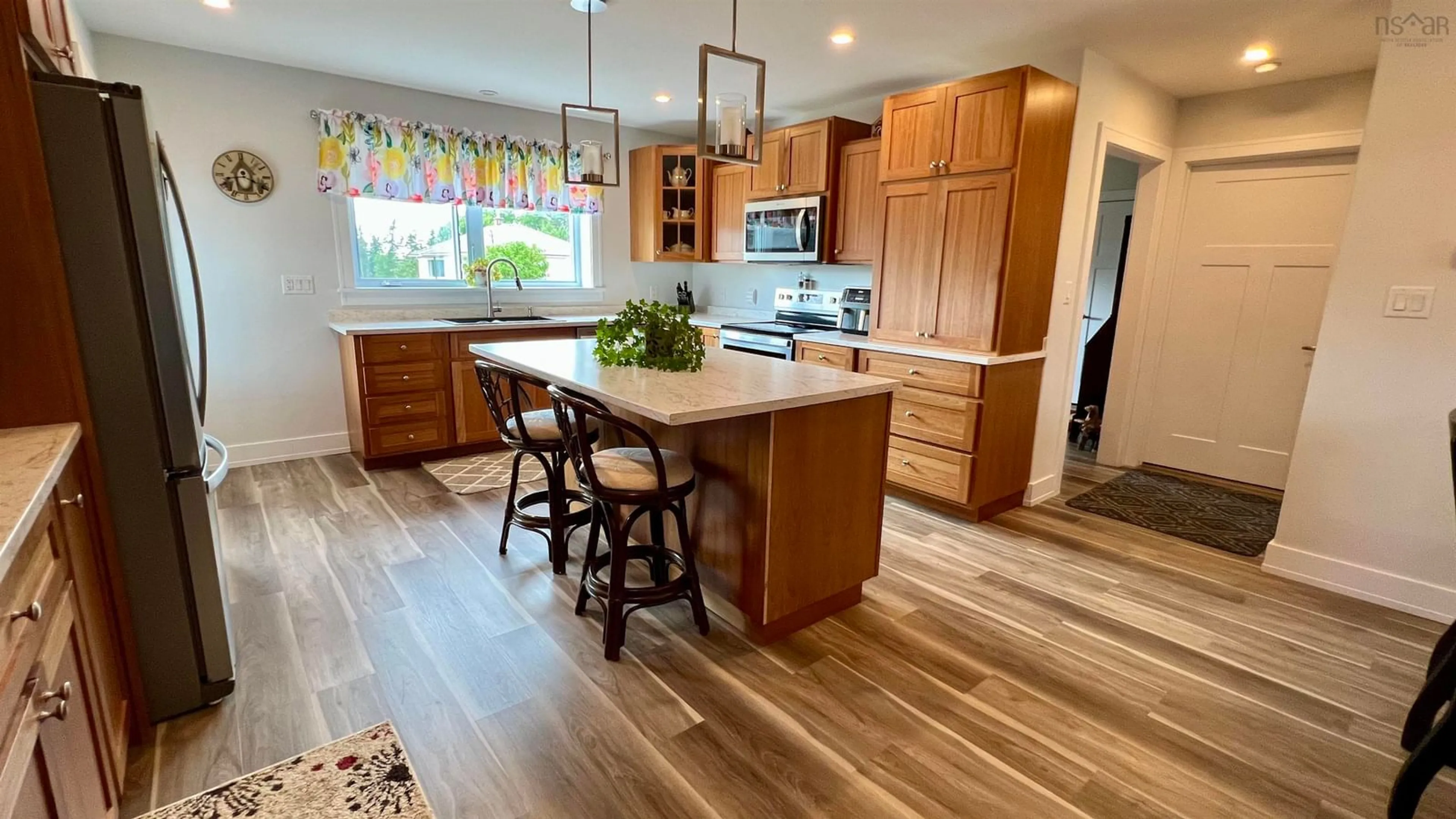 Open concept kitchen, wood/laminate floor for UNIT 1 769 Pictou Rd, East Mountain Nova Scotia B6L 2M8