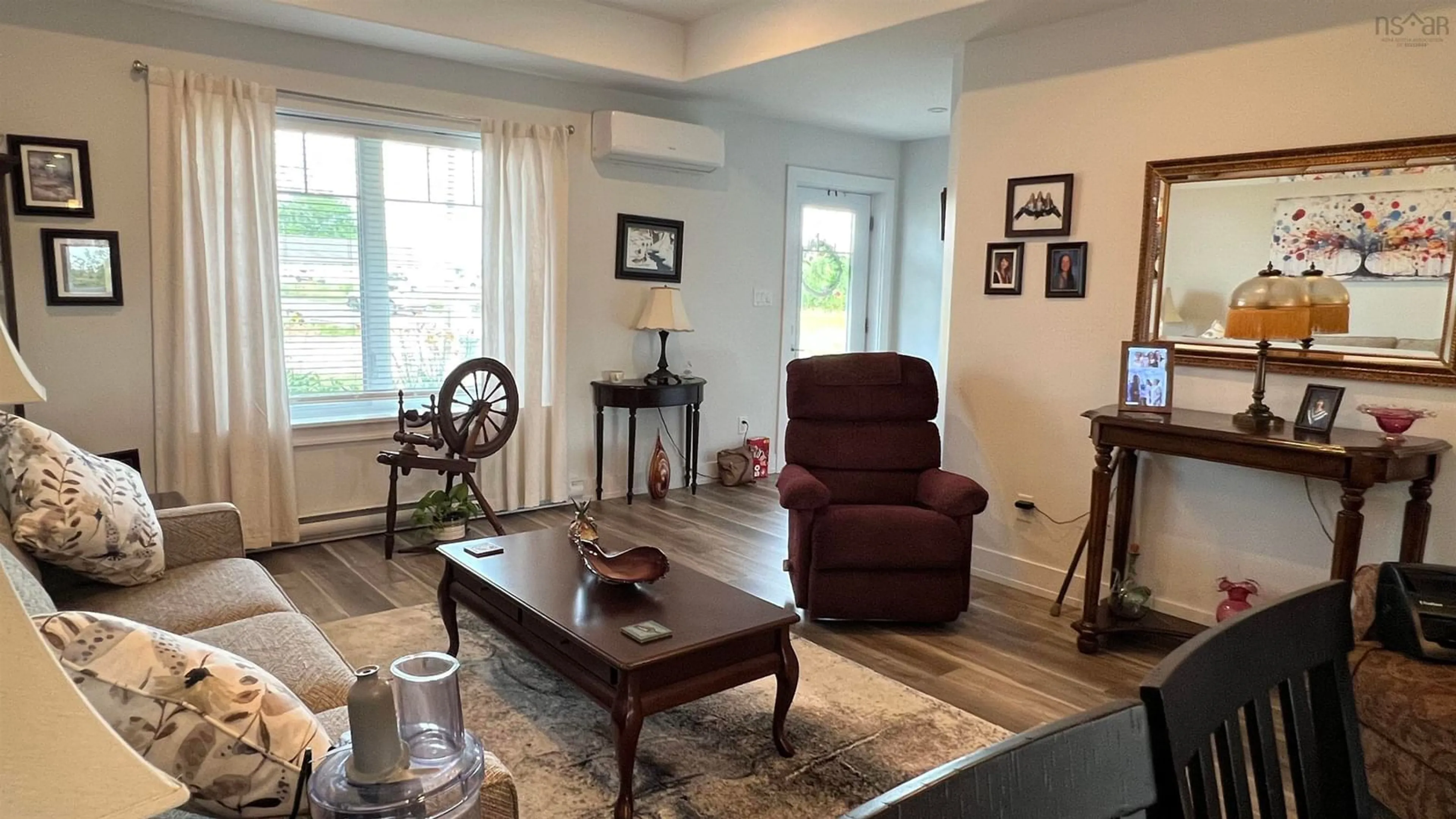 Living room with furniture, wood/laminate floor for UNIT 1 769 Pictou Rd, East Mountain Nova Scotia B6L 2M8