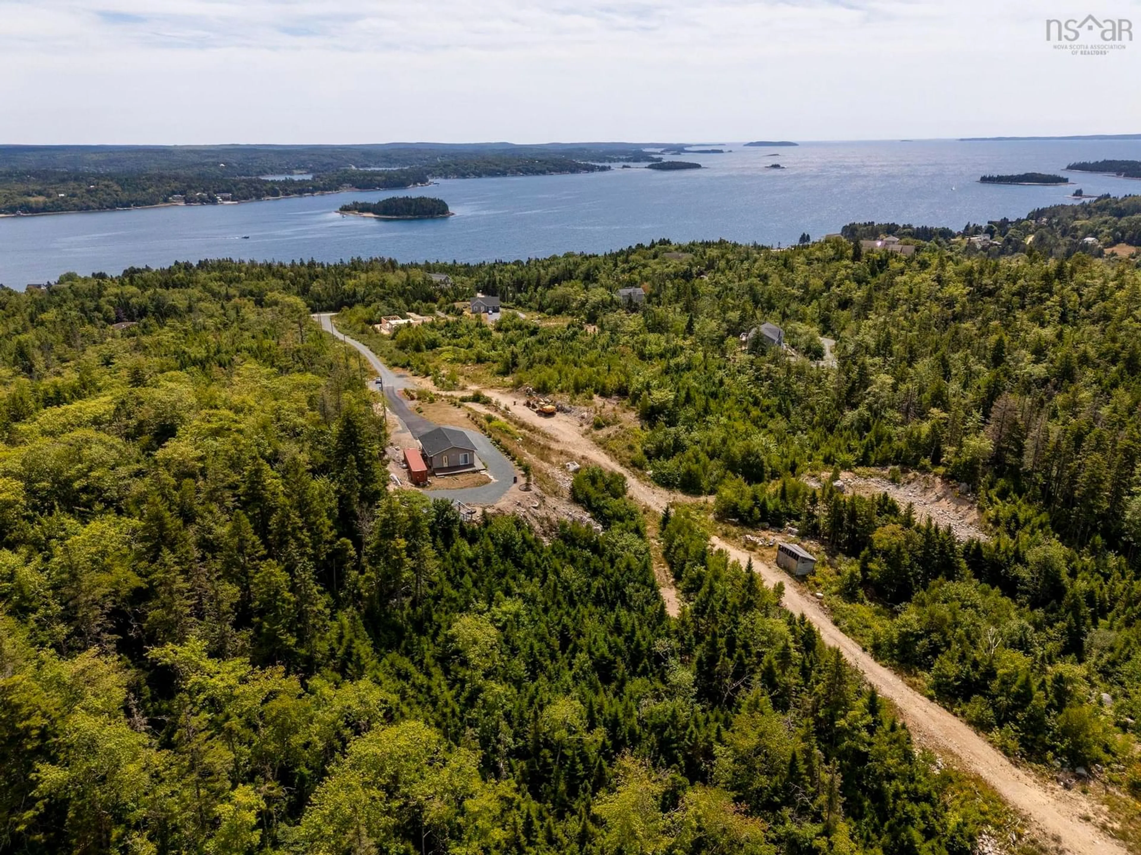 A pic from outside/outdoor area/front of a property/back of a property/a pic from drone, water/lake/river/ocean view for 166 Hillside Dr, Boutiliers Point Nova Scotia B3Z 1W8