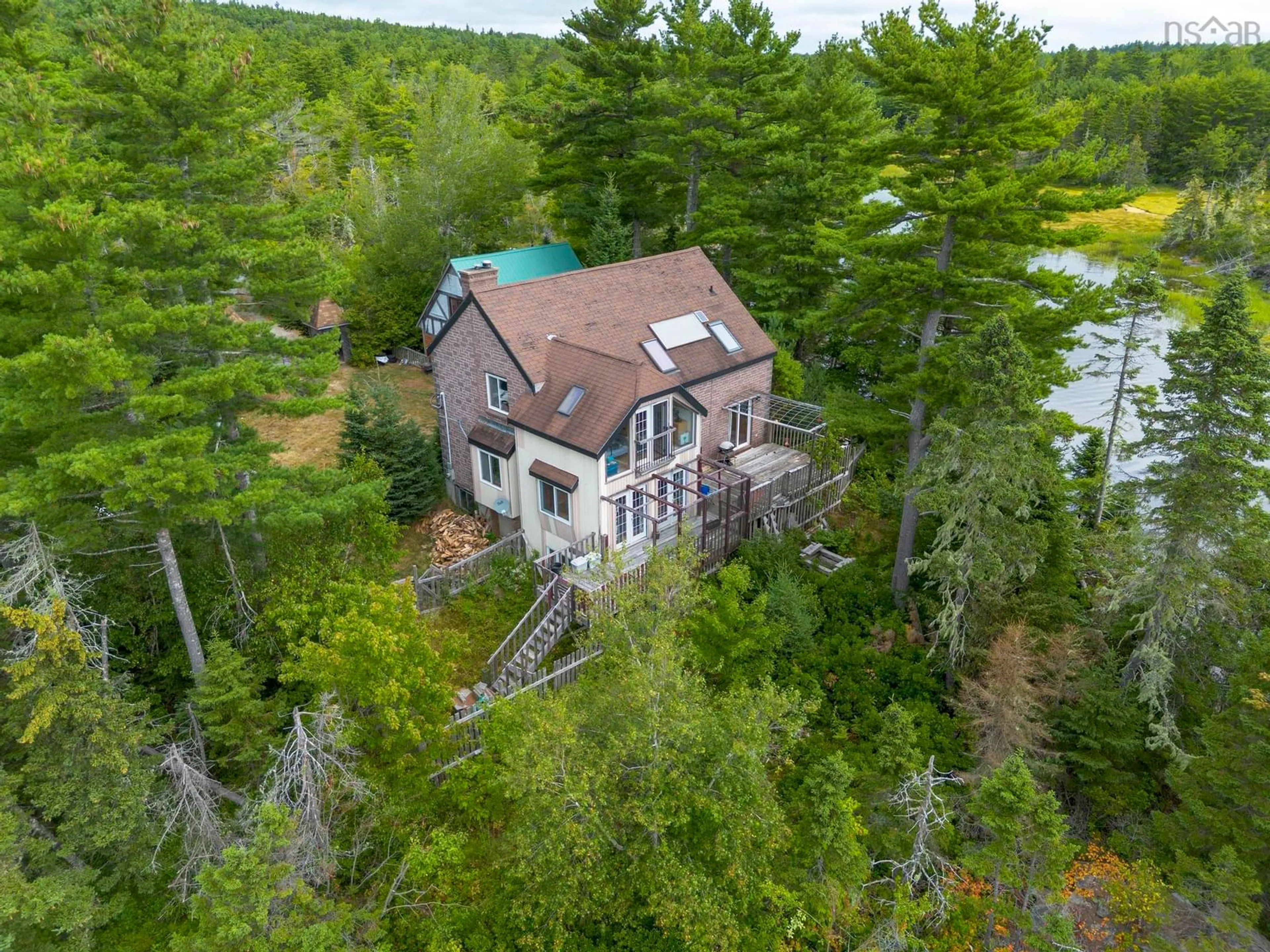 A pic from outside/outdoor area/front of a property/back of a property/a pic from drone, water/lake/river/ocean view for 582 Highway 331, Mill Village Nova Scotia B0J 2H0
