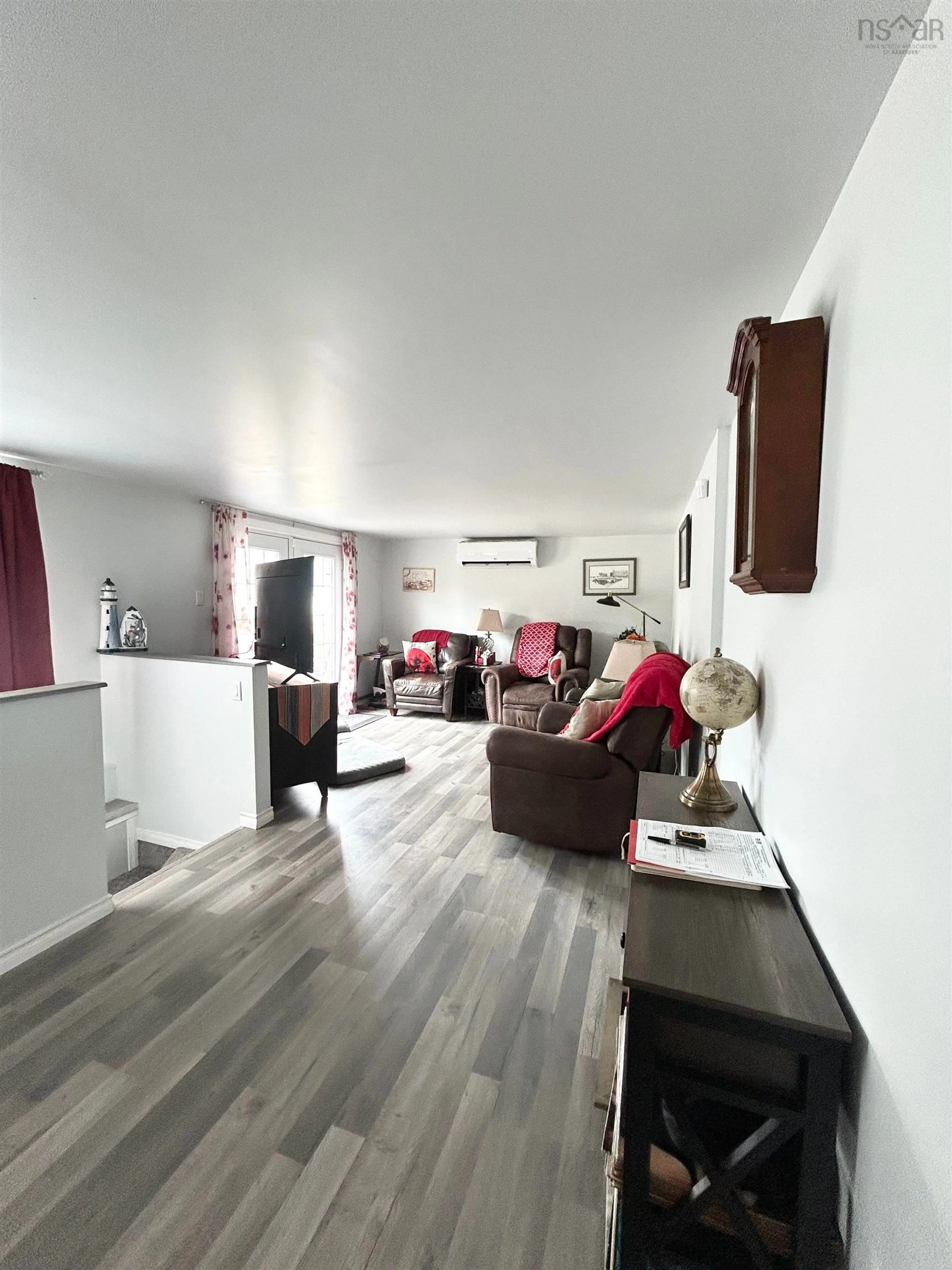 Living room with furniture, wood/laminate floor for 8 Smith Ave, Springhill Nova Scotia B0M 1X0