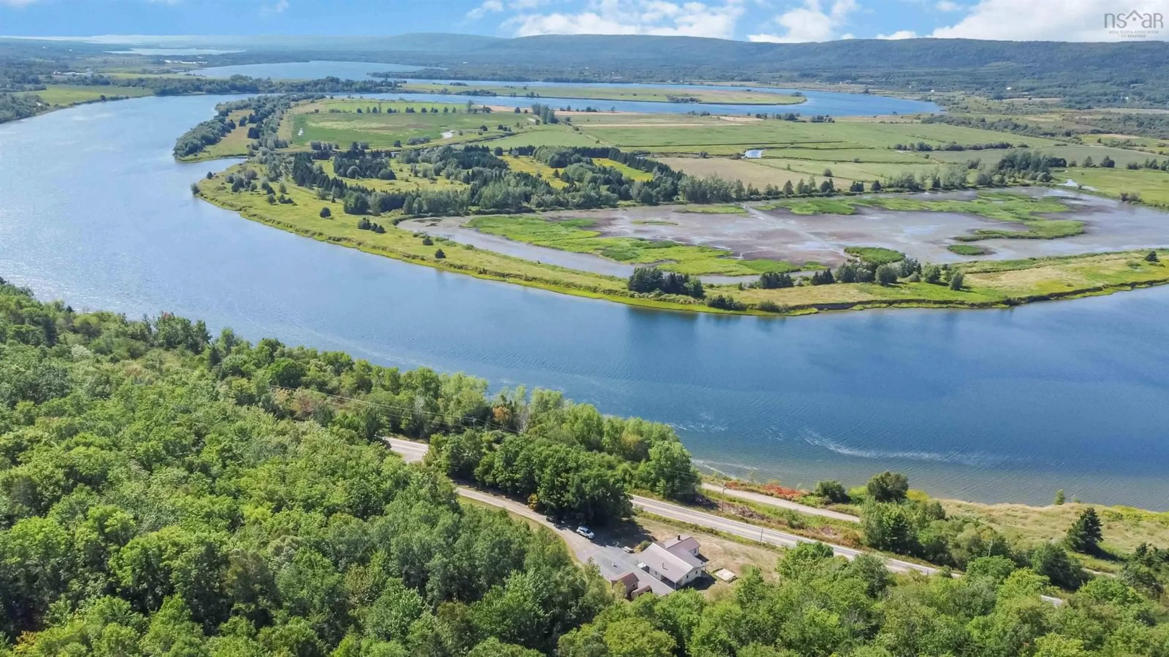 A pic from outside/outdoor area/front of a property/back of a property/a pic from drone, water/lake/river/ocean view for 2284 Highway 201, Tupperville Nova Scotia B0S 1C0