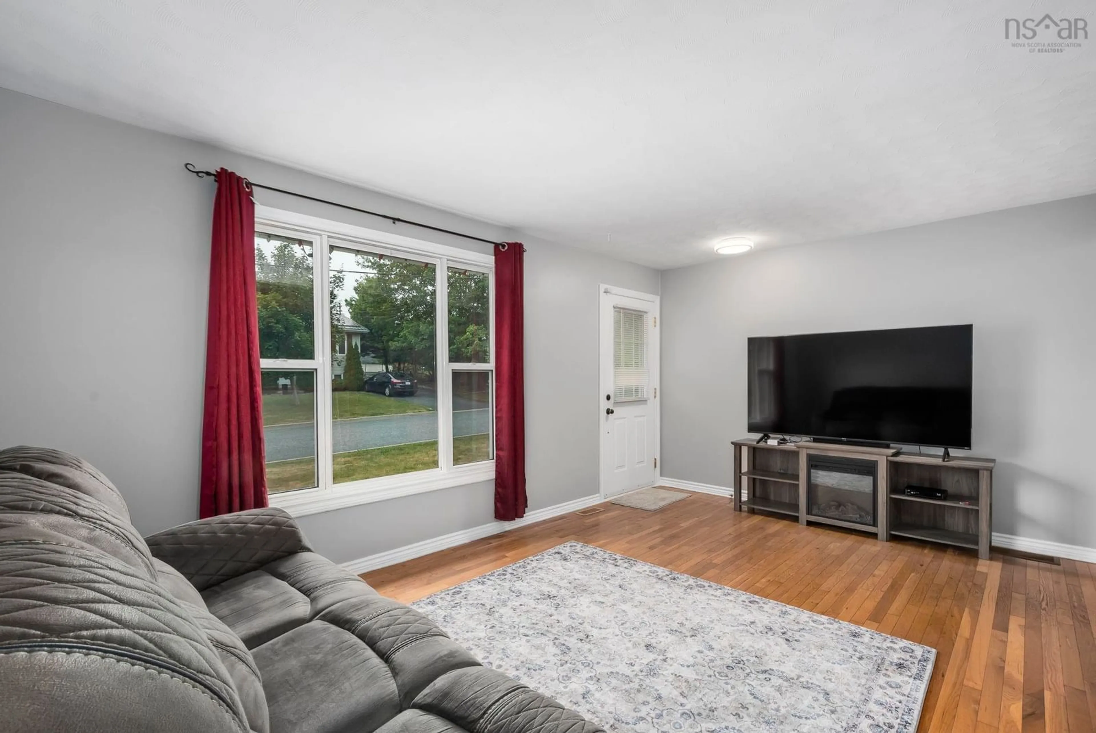 Living room with furniture, wood/laminate floor for 5 Kirtland Crt, Dartmouth Nova Scotia B2W 4P6