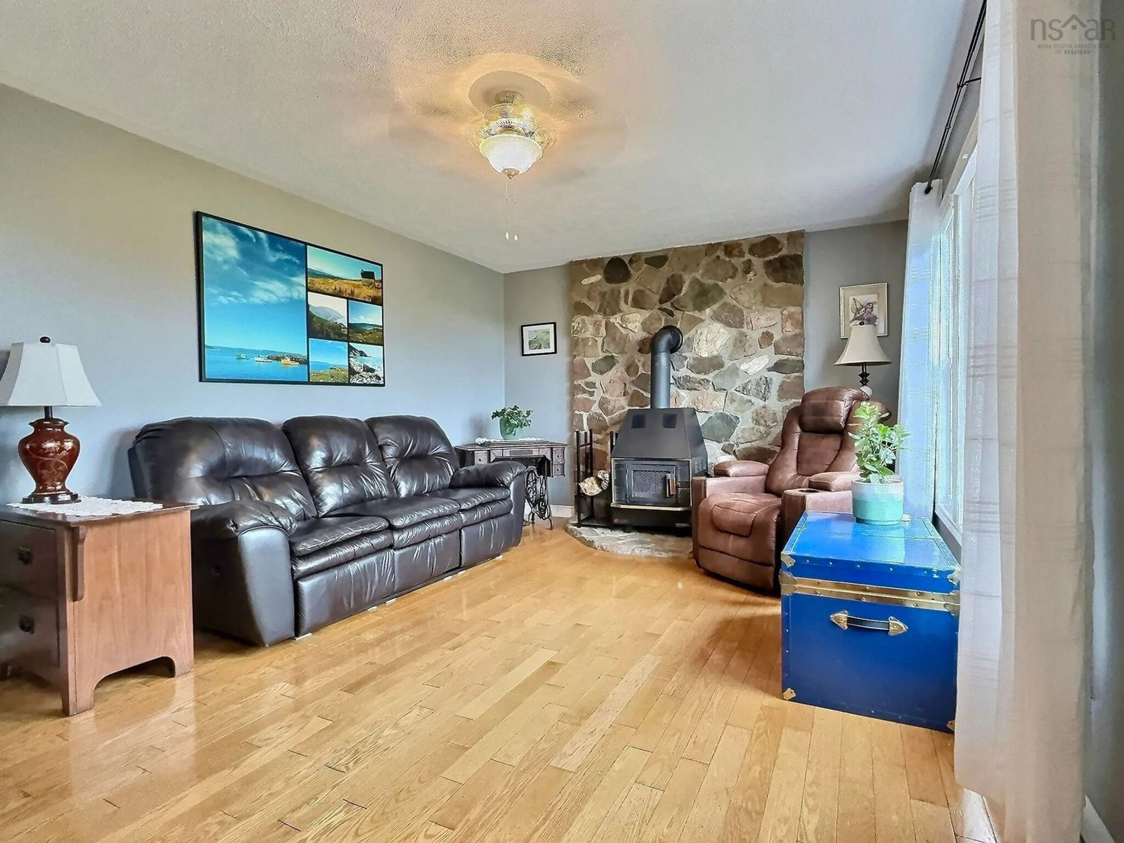Living room with furniture, unknown for 15776 Cabot Trail Rd, Chéticamp Nova Scotia B0E 1H0