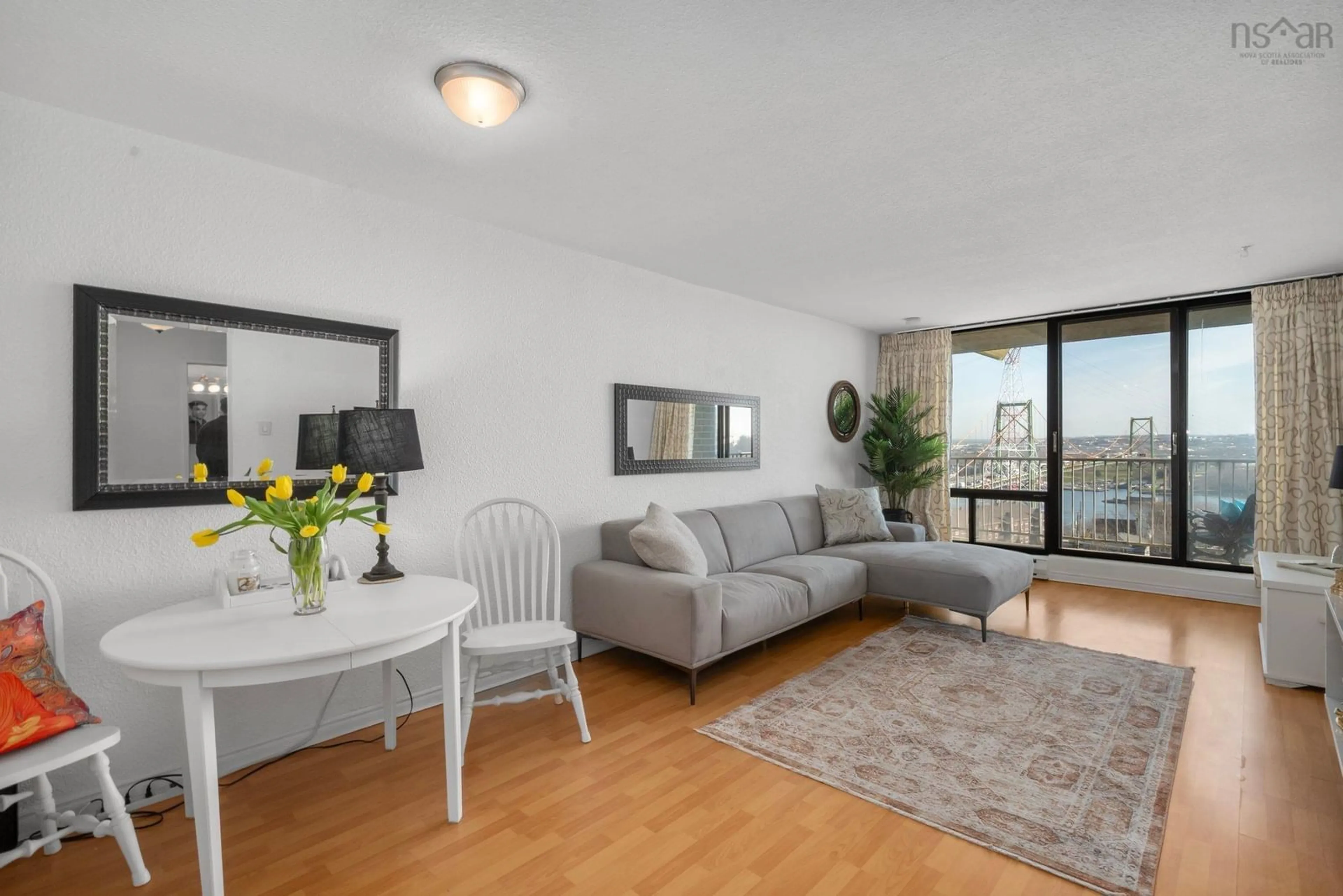 Living room with furniture, wood/laminate floor for 5572 North Ridge Rd #1002, Halifax Nova Scotia B3K 5K2