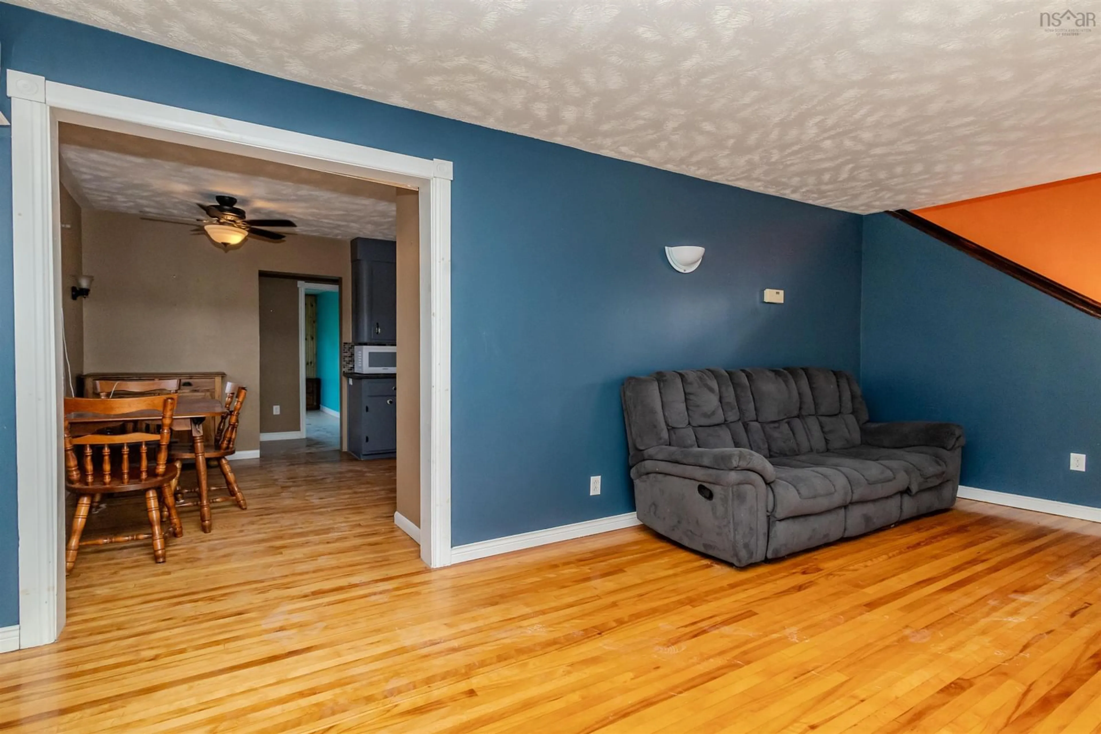 Living room with furniture, wood/laminate floor for 366 Cabot St, Sydney Nova Scotia B1P 4G2