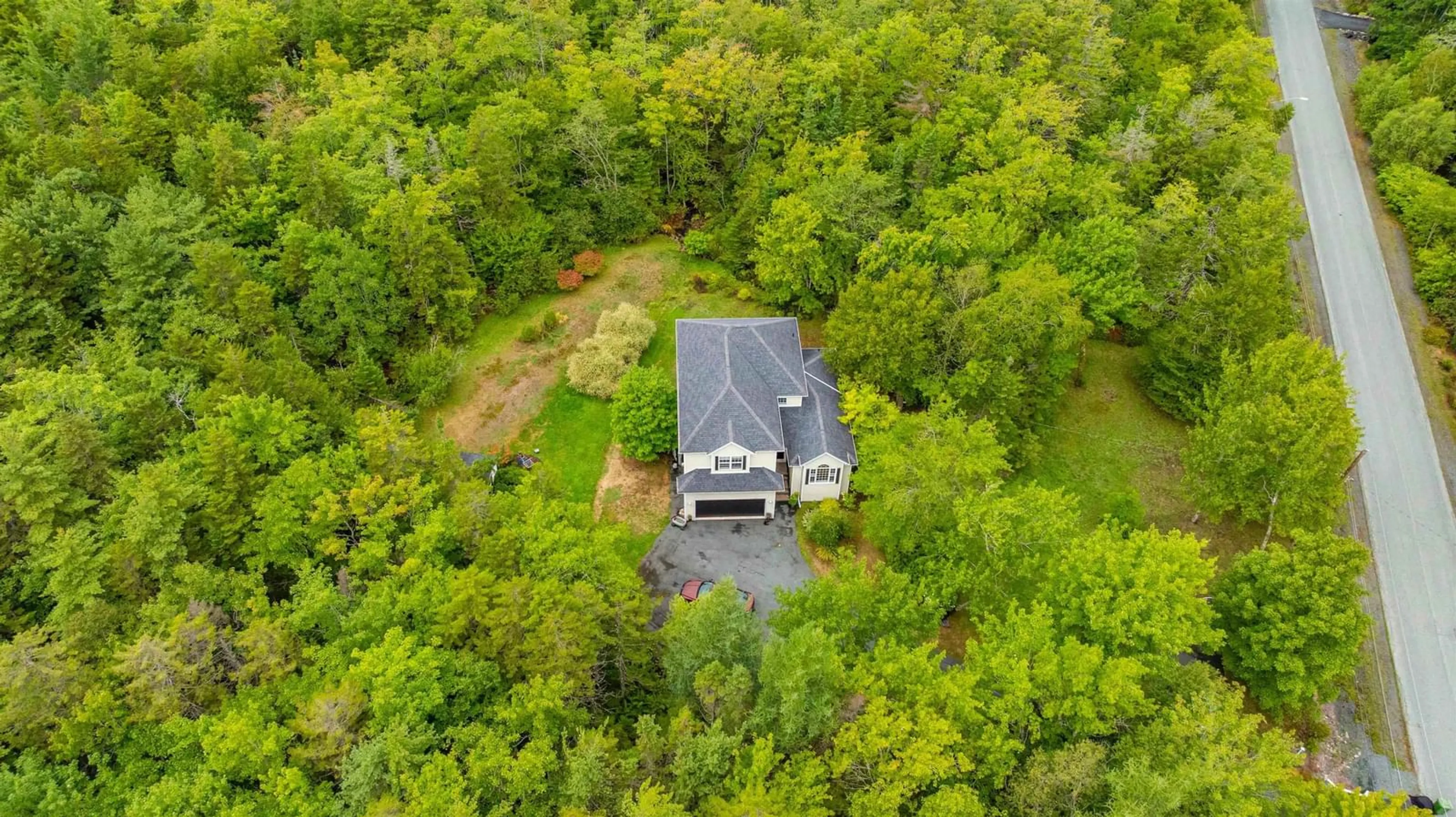 A pic from outside/outdoor area/front of a property/back of a property/a pic from drone, forest/trees view for 60 Blue Forest Lane, Hammonds Plains Nova Scotia B4B 1L1