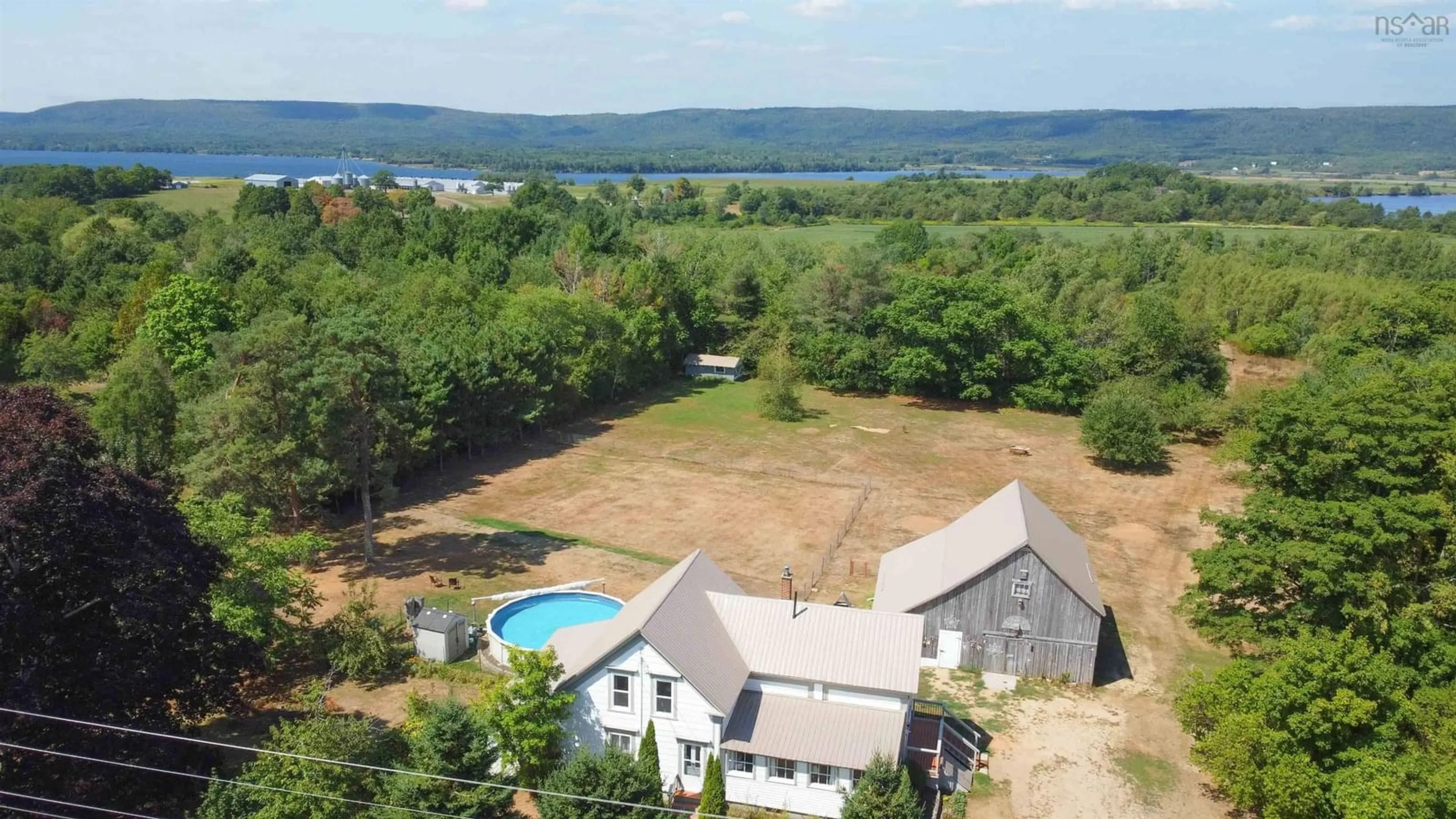 A pic from outside/outdoor area/front of a property/back of a property/a pic from drone, water/lake/river/ocean view for 1769 Highway 201, Round Hill Nova Scotia B0S 1A0