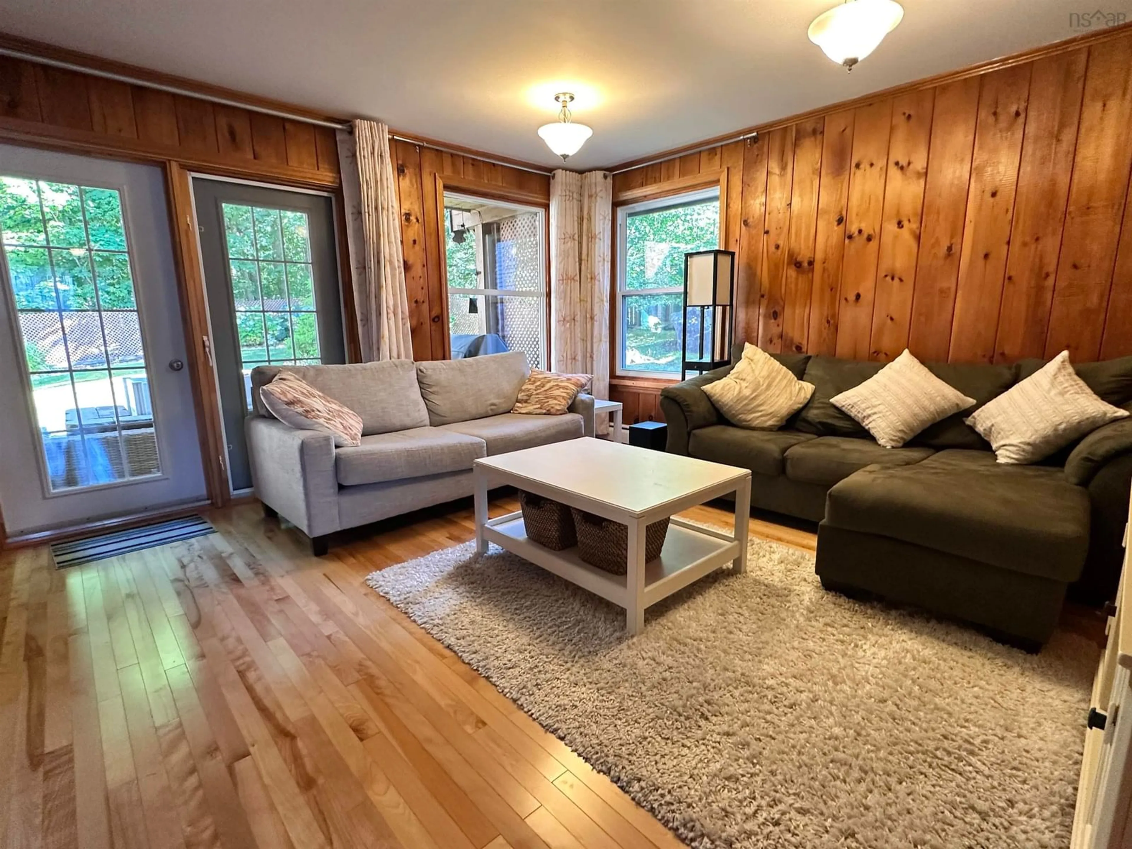 Living room with furniture, wood/laminate floor for 167 Church St, Liverpool Nova Scotia B0T 1K0