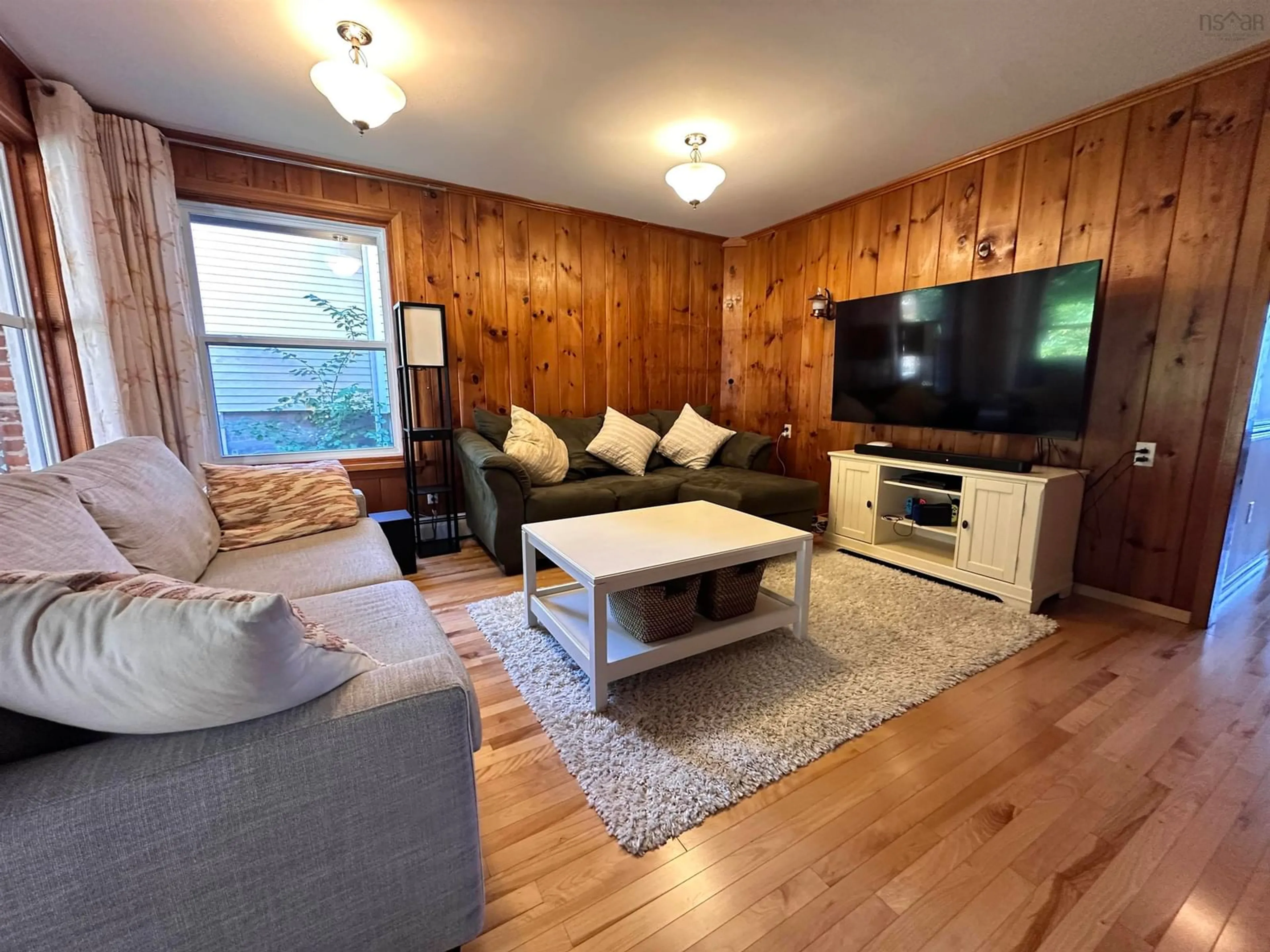 Living room with furniture, wood/laminate floor for 167 Church St, Liverpool Nova Scotia B0T 1K0