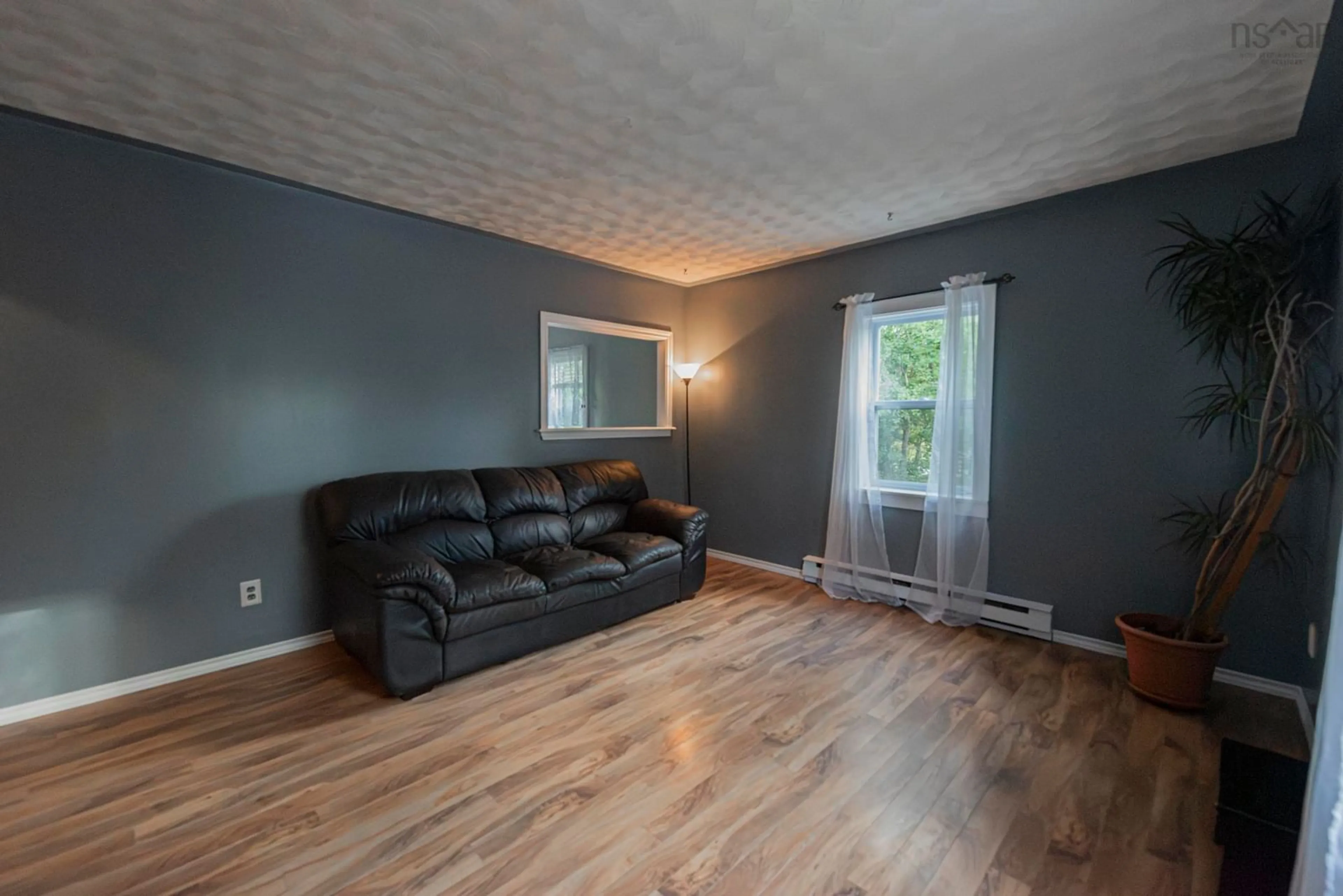 Living room with furniture, wood/laminate floor for 2324 Truro Rd, Westville Nova Scotia B0K 2A0