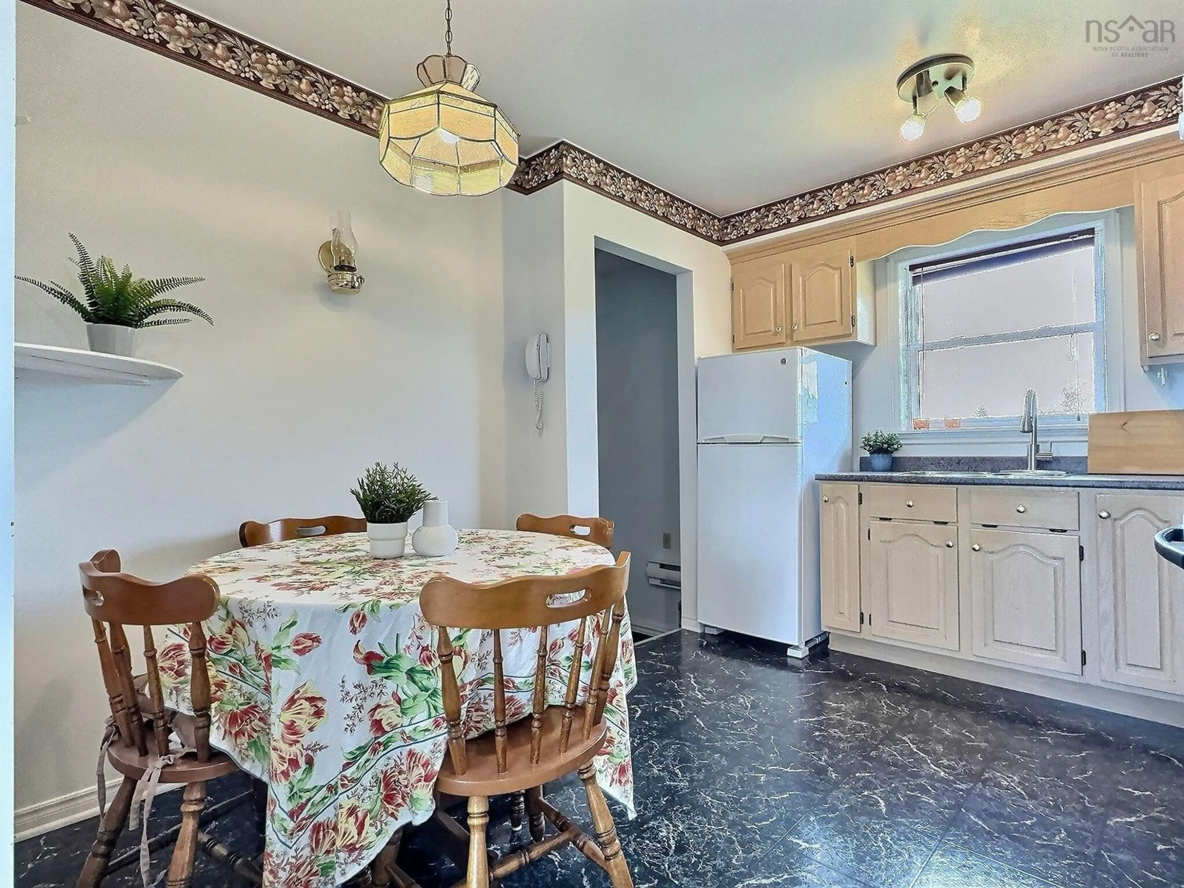 Standard kitchen, ceramic/tile floor for 13447 Cabot Trail Rd, Grand Étang Nova Scotia B0E 1L0