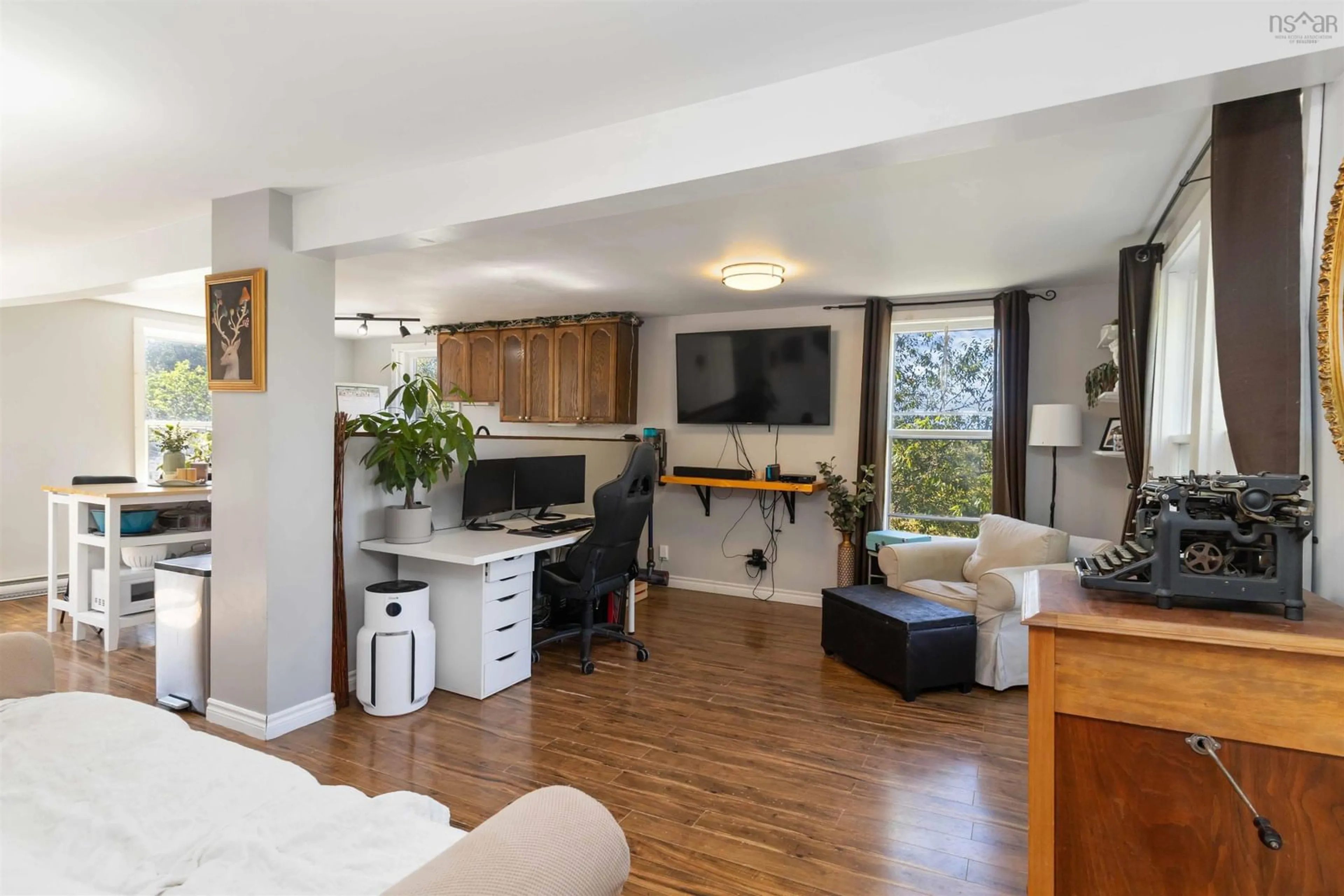 Living room with furniture, wood/laminate floor for 2267 Highway 210, Chelsea Nova Scotia B4V 7M1