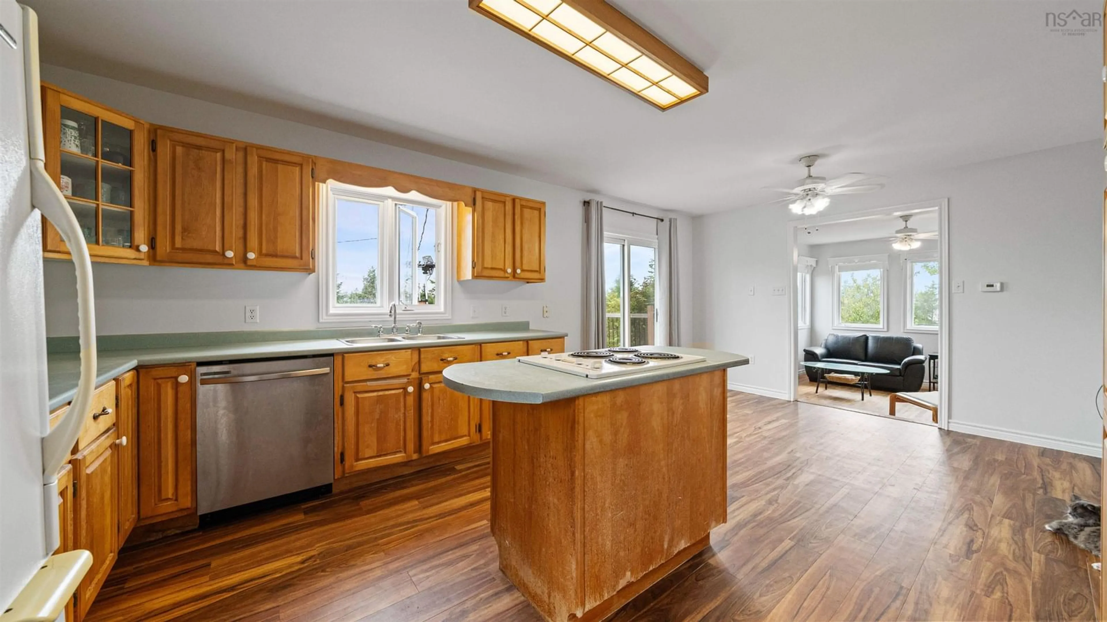 Open concept kitchen, wood/laminate floor for 111 Myers Point Rd, Head Of Jeddore Nova Scotia B0J 1P0