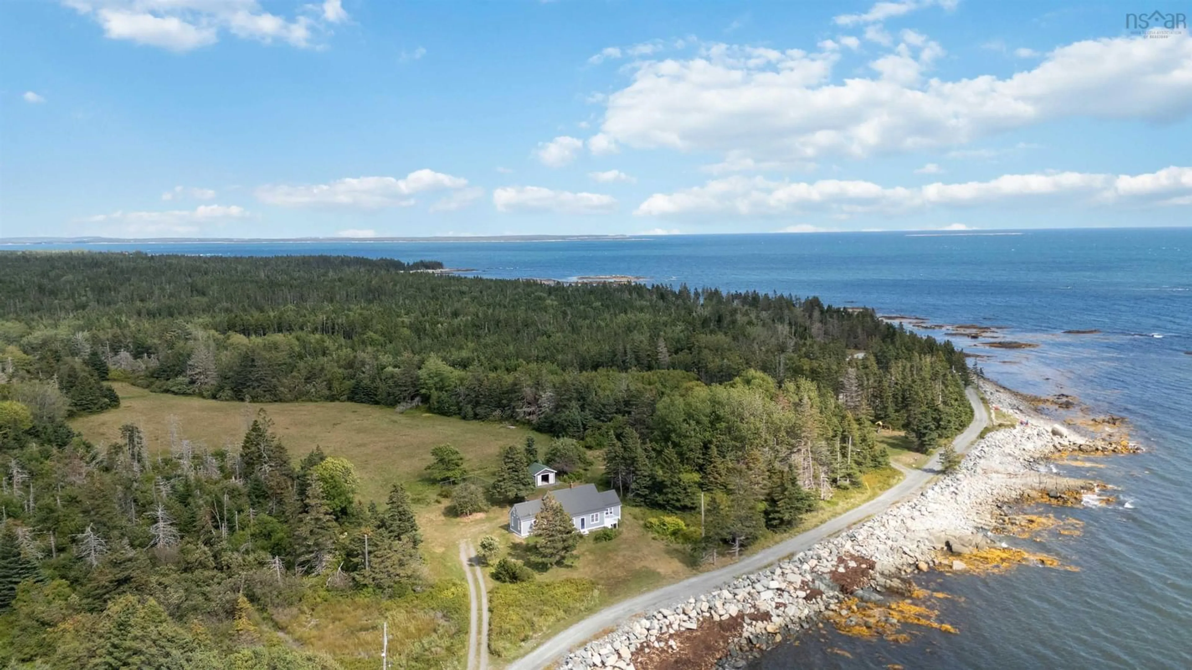 A pic from outside/outdoor area/front of a property/back of a property/a pic from drone, water/lake/river/ocean view for 99 Bear Trap Rd, Broad Cove Nova Scotia B0J 2H0