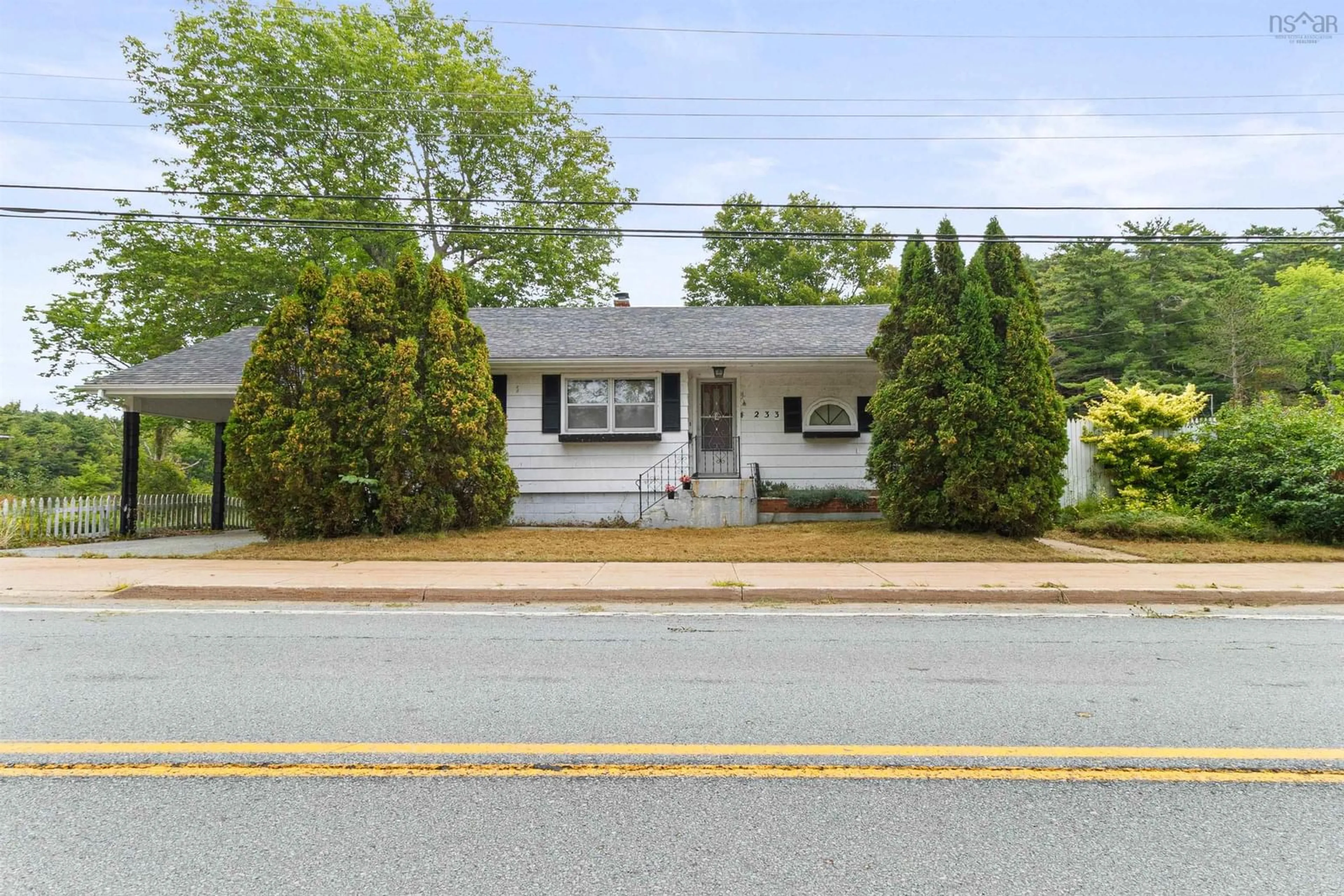 Home with vinyl exterior material, street for 233 Highway 8, Milton Nova Scotia B0T 1P0