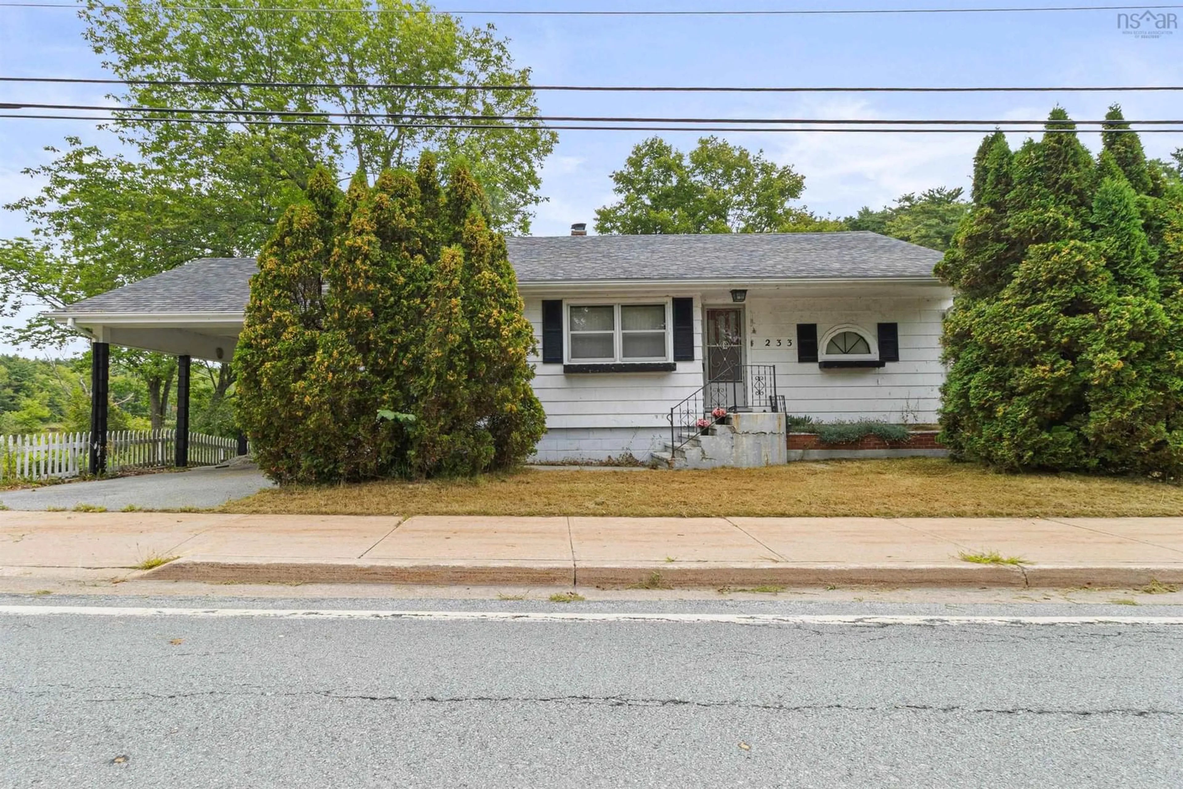 Home with vinyl exterior material, street for 233 Highway 8, Milton Nova Scotia B0T 1P0