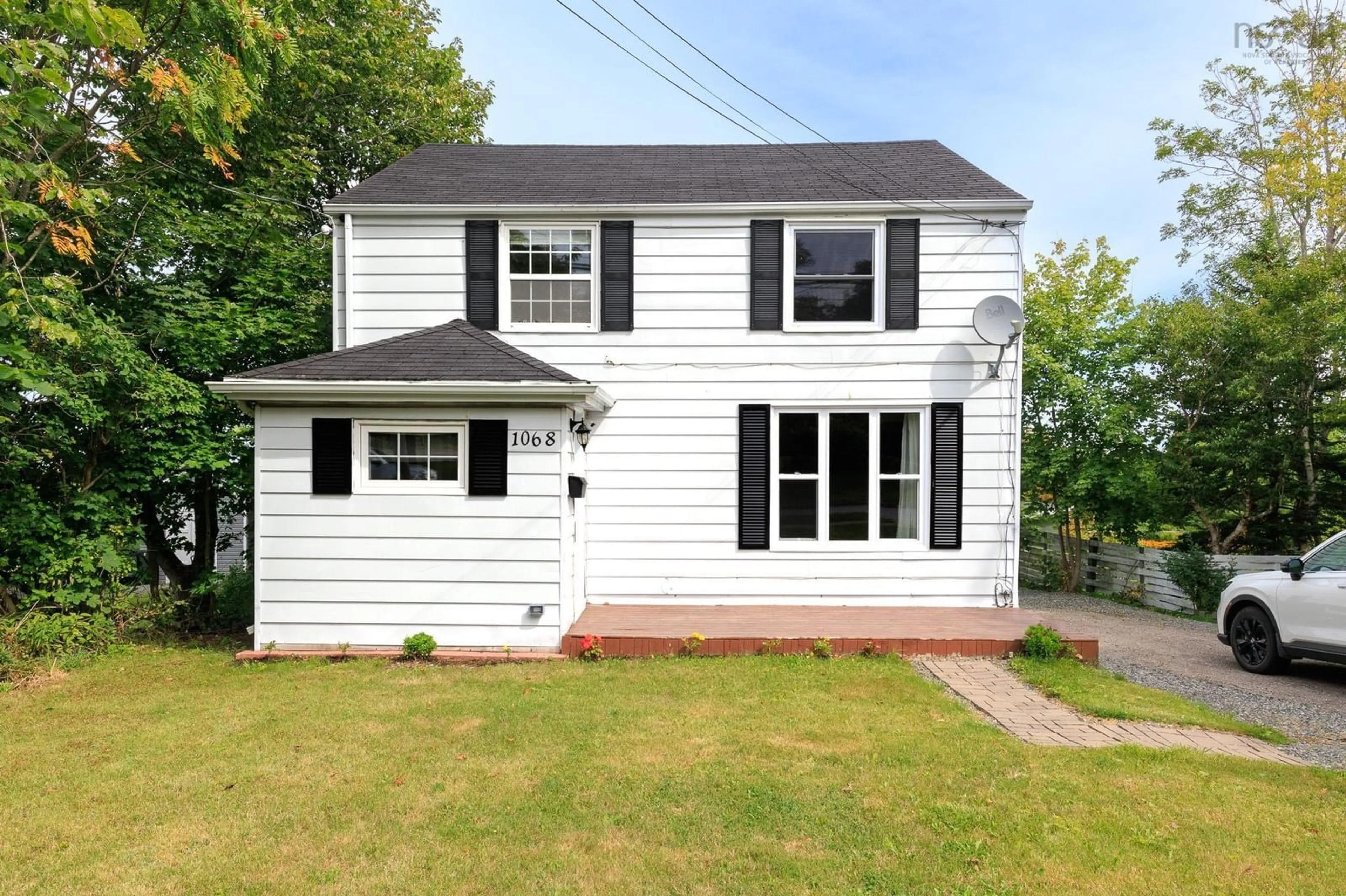 Home with vinyl exterior material, street for 1068 Main Street, Glace Bay Nova Scotia B1A 4Z7