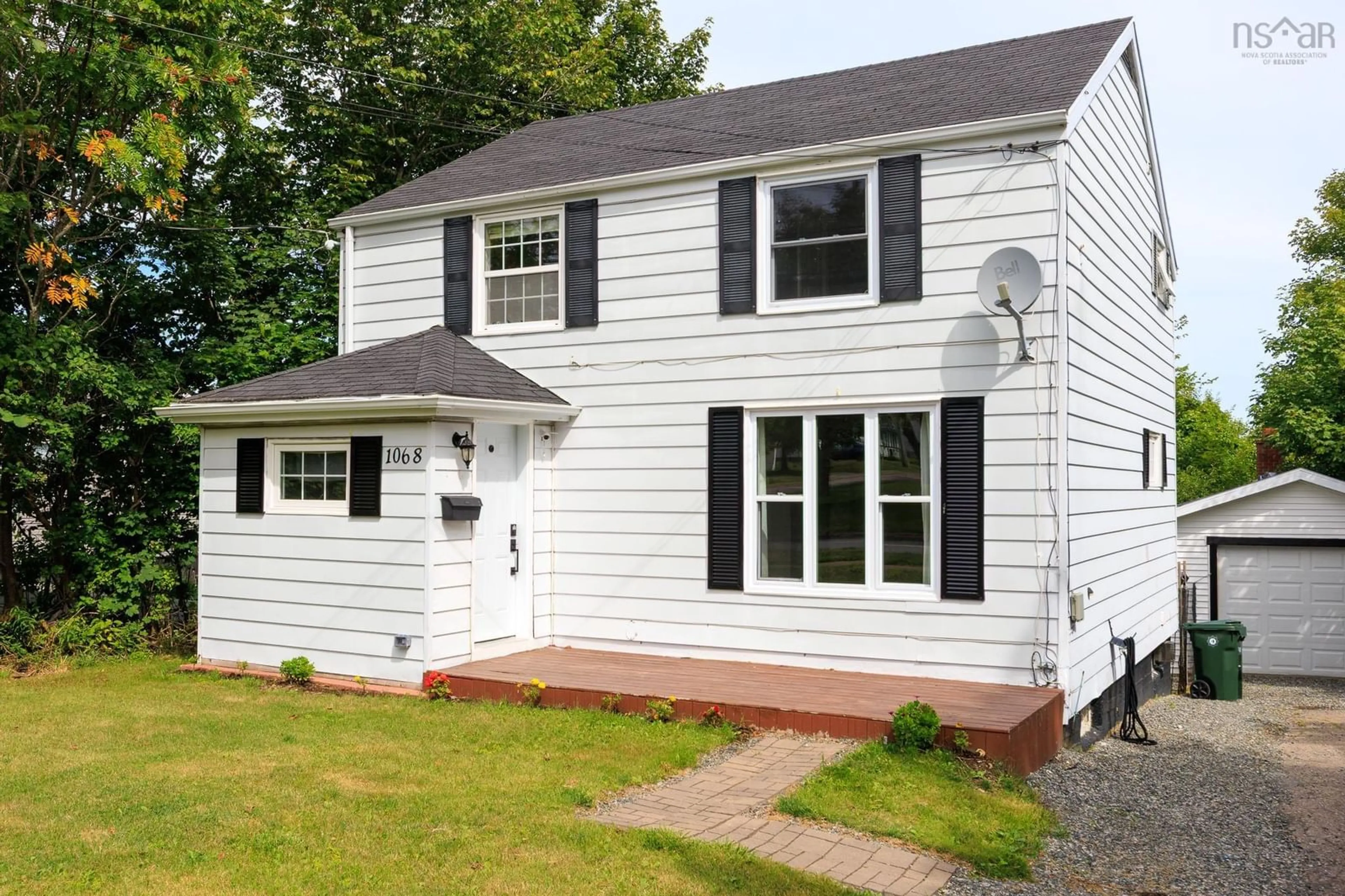 Home with vinyl exterior material, street for 1068 Main Street, Glace Bay Nova Scotia B1A 4Z7
