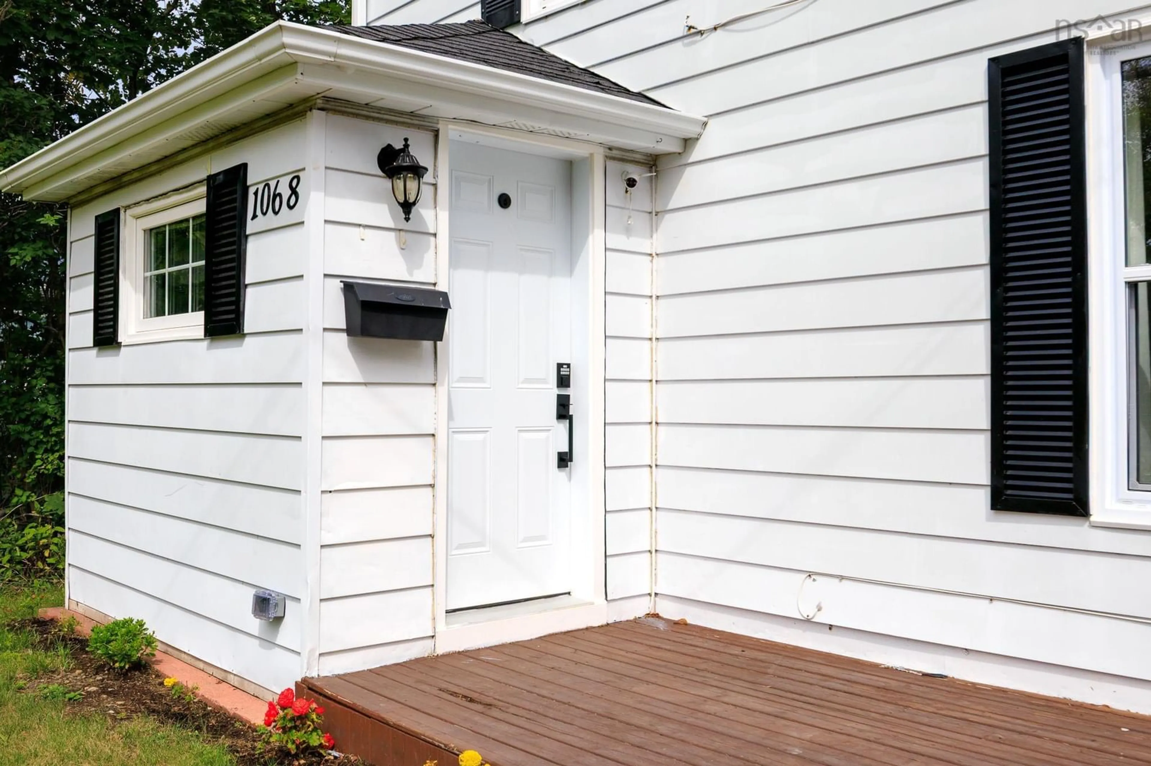 Home with vinyl exterior material, street for 1068 Main Street, Glace Bay Nova Scotia B1A 4Z7