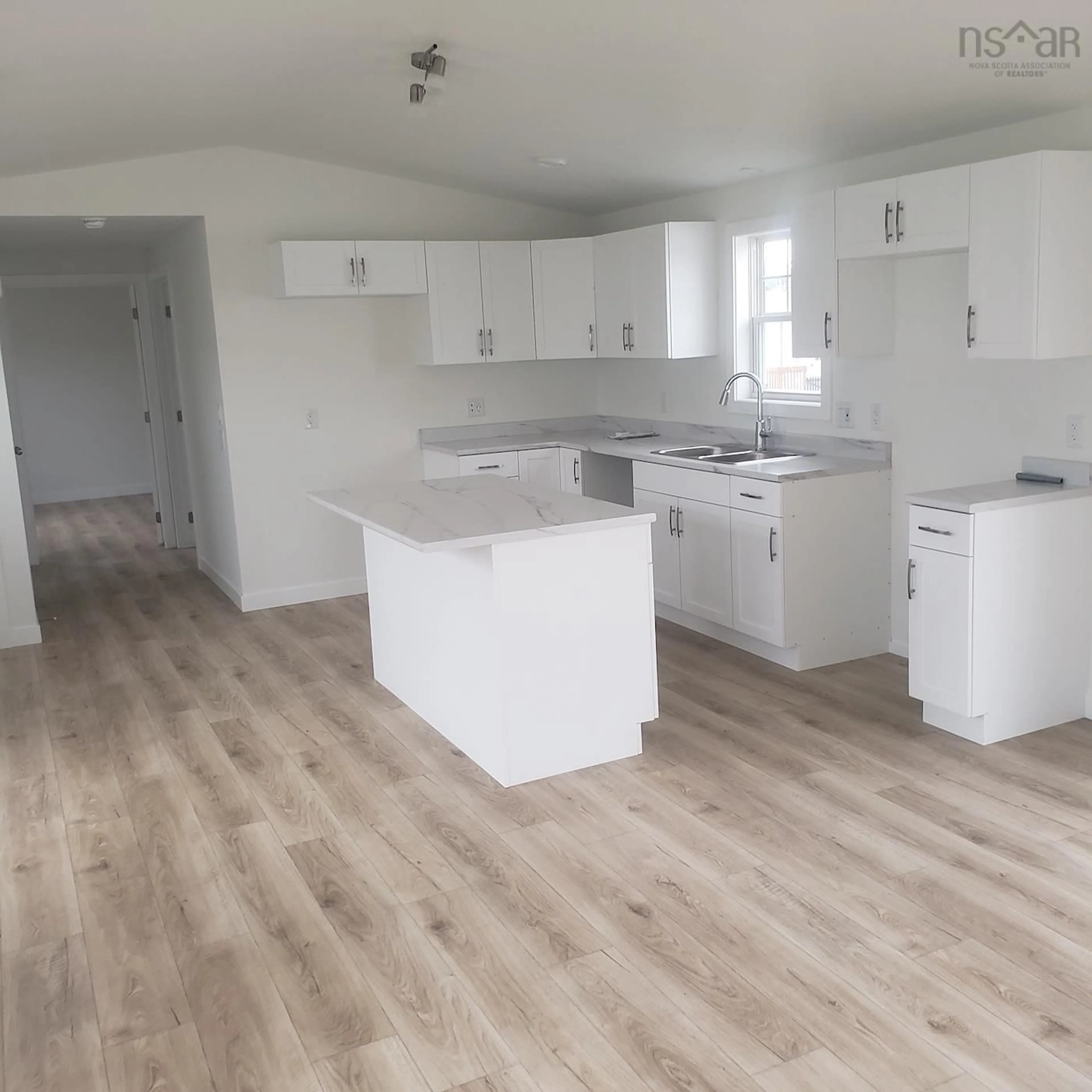 Open concept kitchen, wood/laminate floor for 10 Elmwood Dr, Lower South River Nova Scotia B2G 0E7