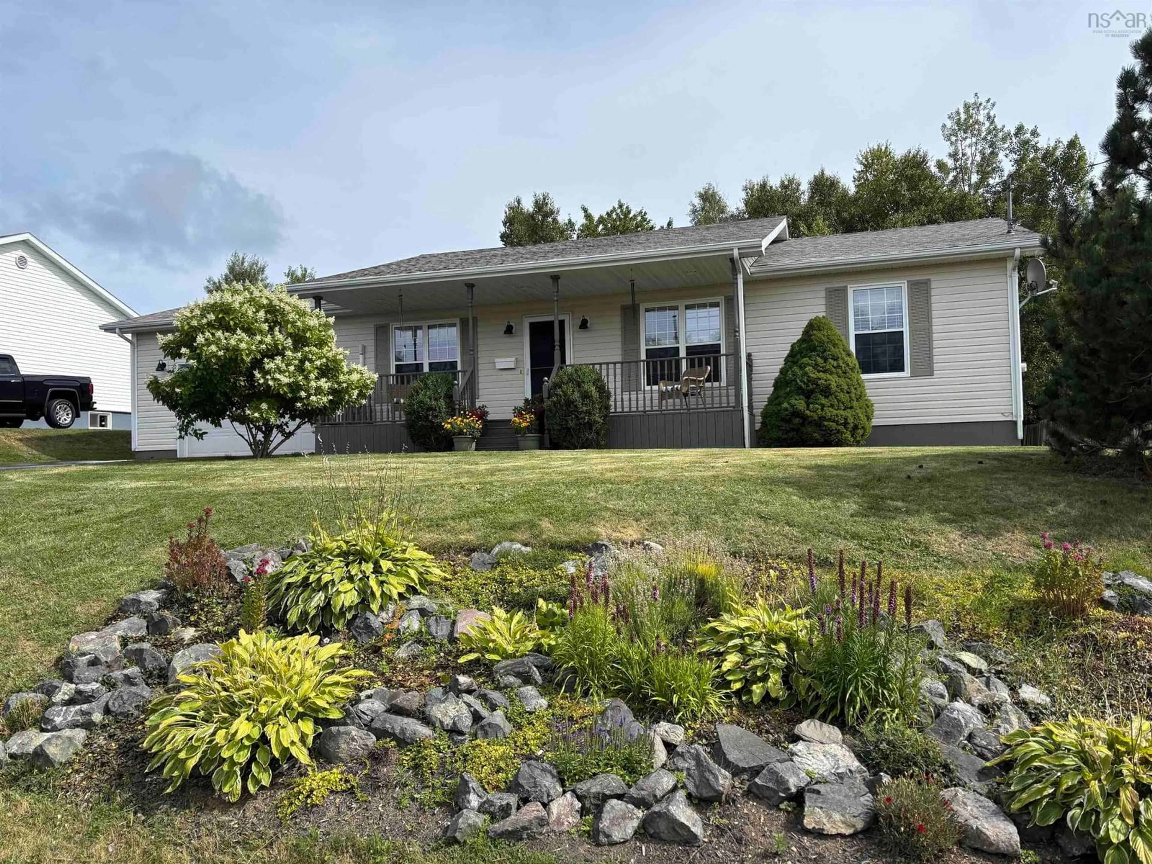 A pic from outside/outdoor area/front of a property/back of a property/a pic from drone, water/lake/river/ocean view for 63 Mae Avenue, Sydney Mines Nova Scotia B1V 3K8