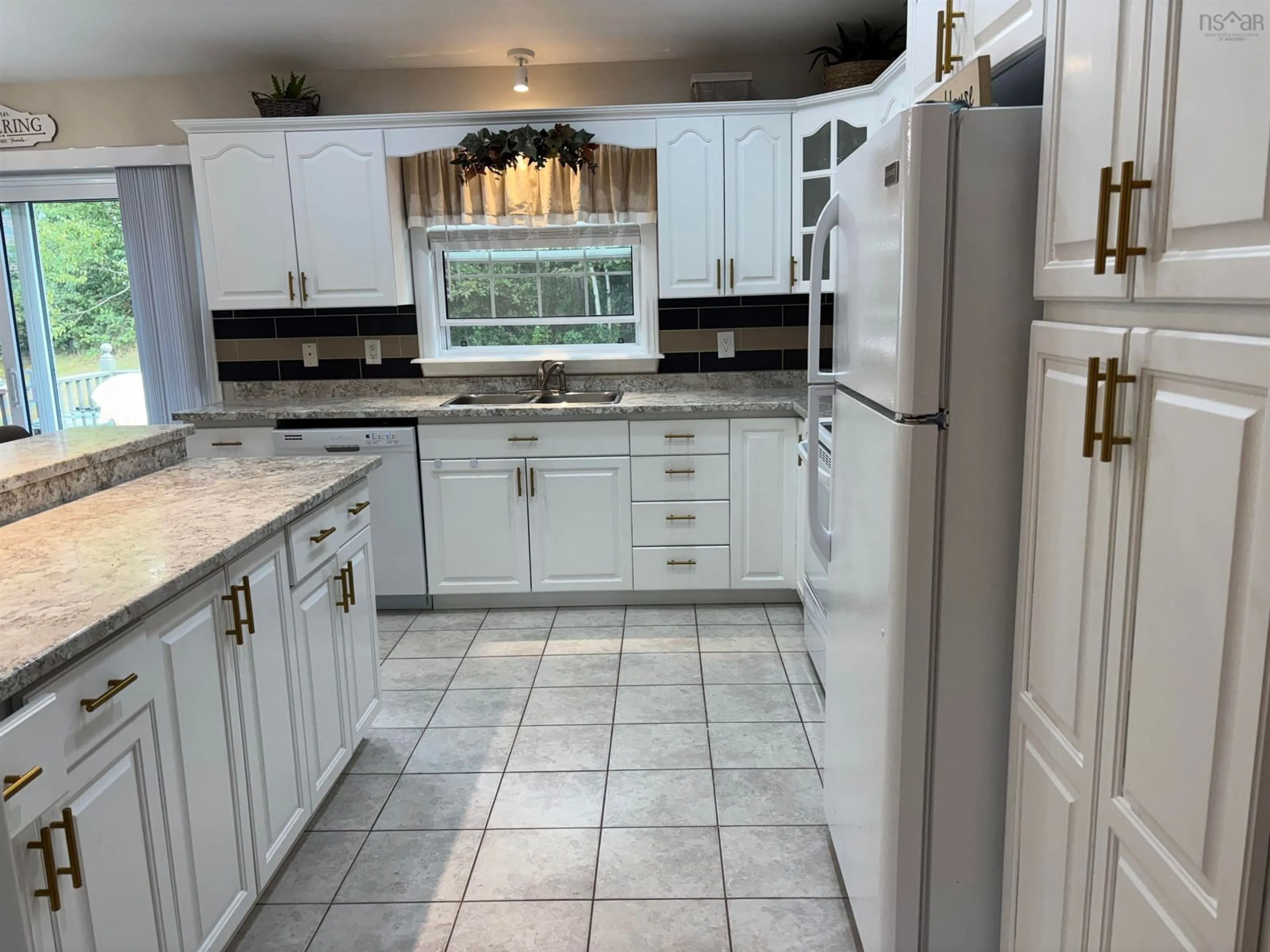 Open concept kitchen, ceramic/tile floor for 63 Mae Avenue, Sydney Mines Nova Scotia B1V 3K8
