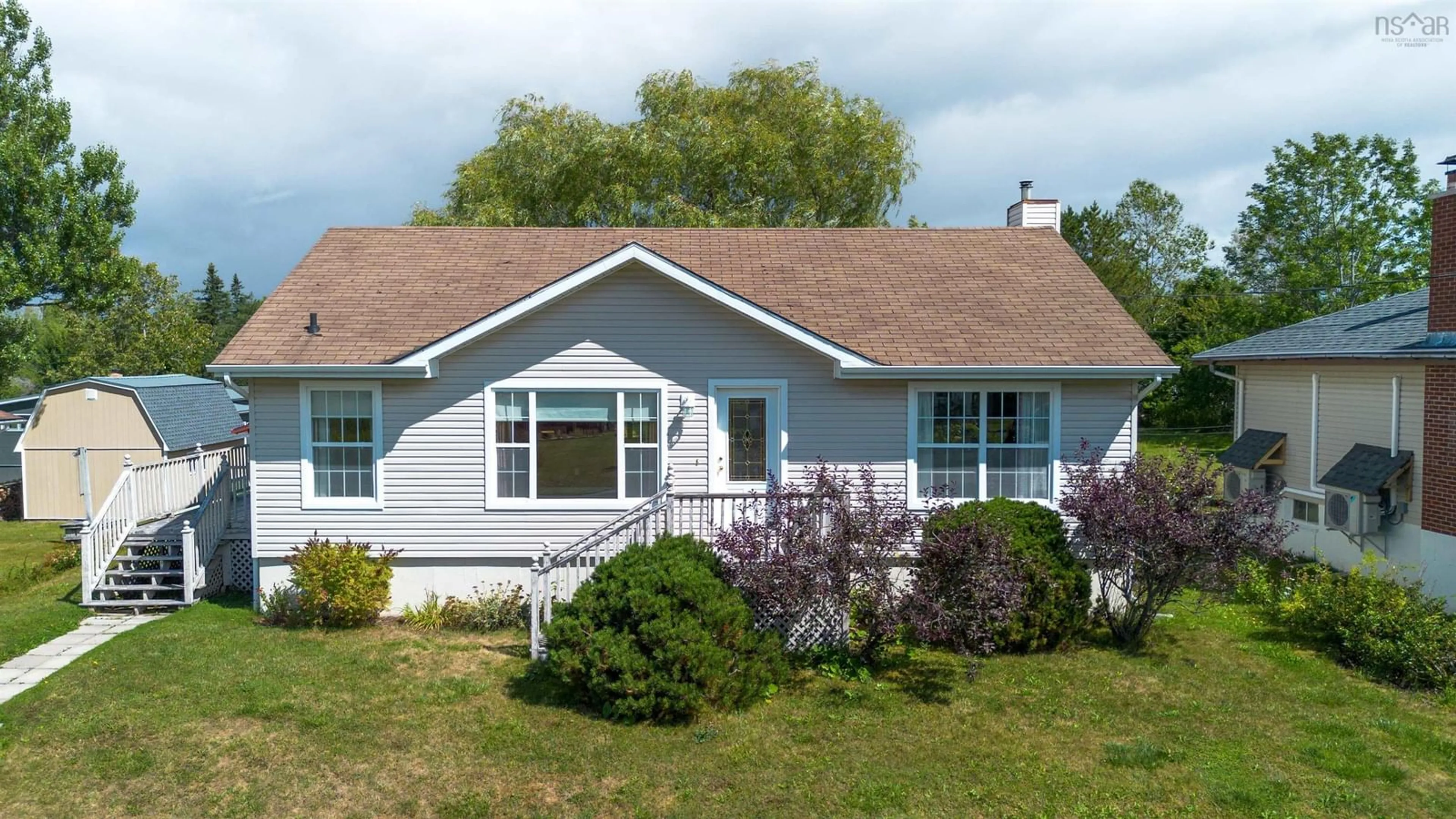Home with vinyl exterior material, street for 174 Twining St, Baddeck Nova Scotia B0E 1B0