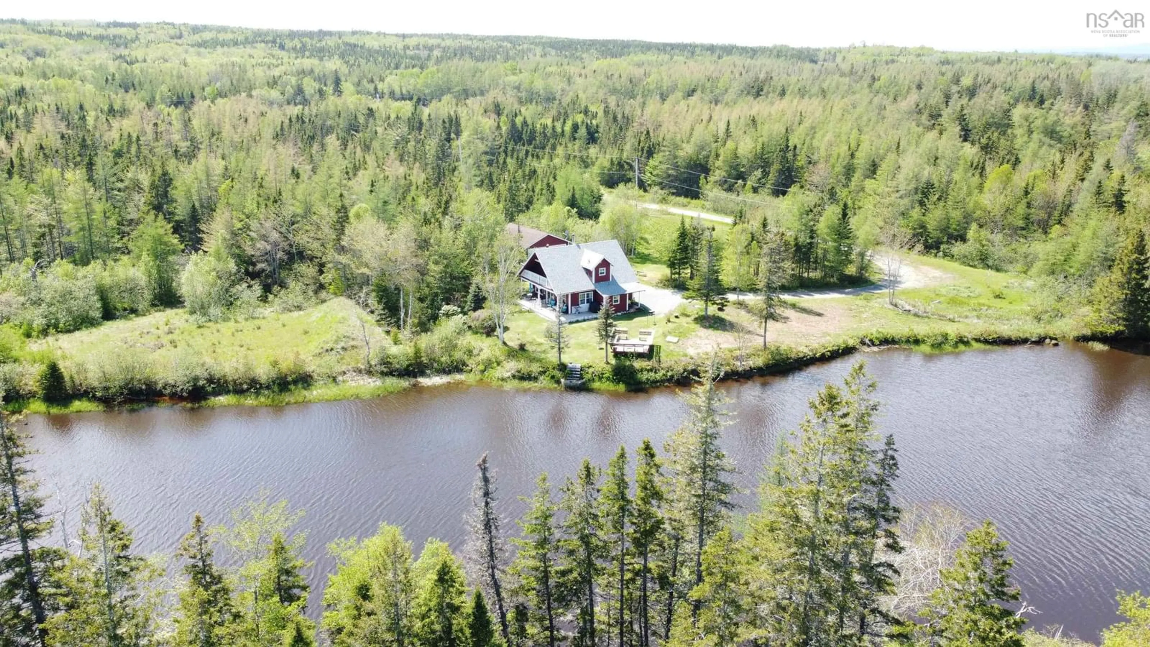 A pic from outside/outdoor area/front of a property/back of a property/a pic from drone, water/lake/river/ocean view for 77 Lower River Rd, Cleveland Nova Scotia B0E 1J0