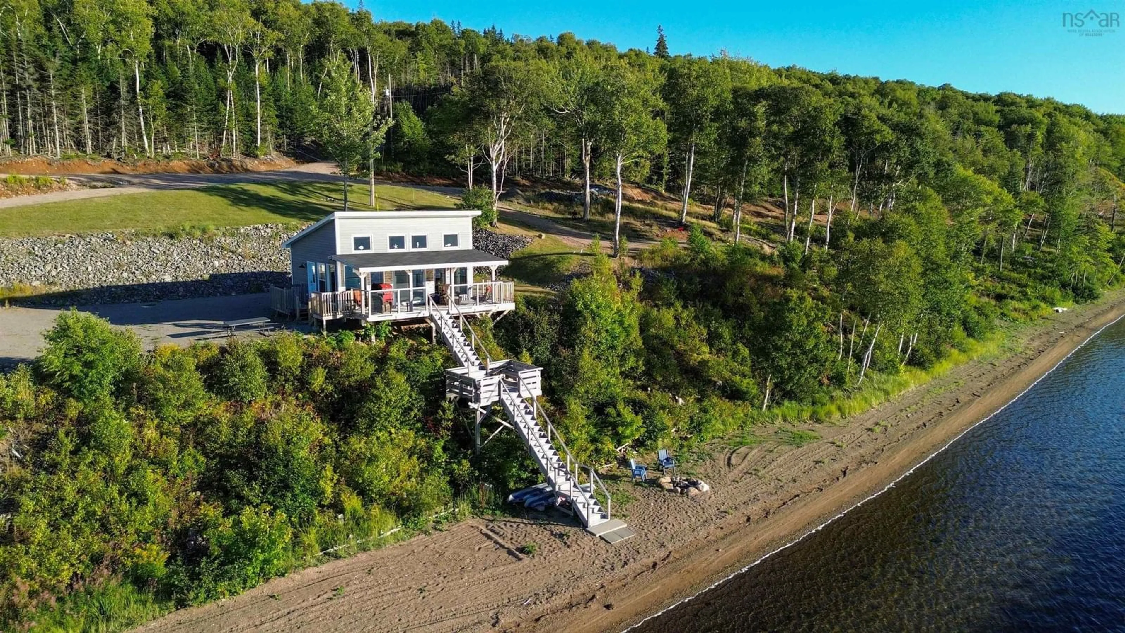 A pic from outside/outdoor area/front of a property/back of a property/a pic from drone, water/lake/river/ocean view for 10823 Kempt Head Rd, Boularderie Nova Scotia B1X 1L5
