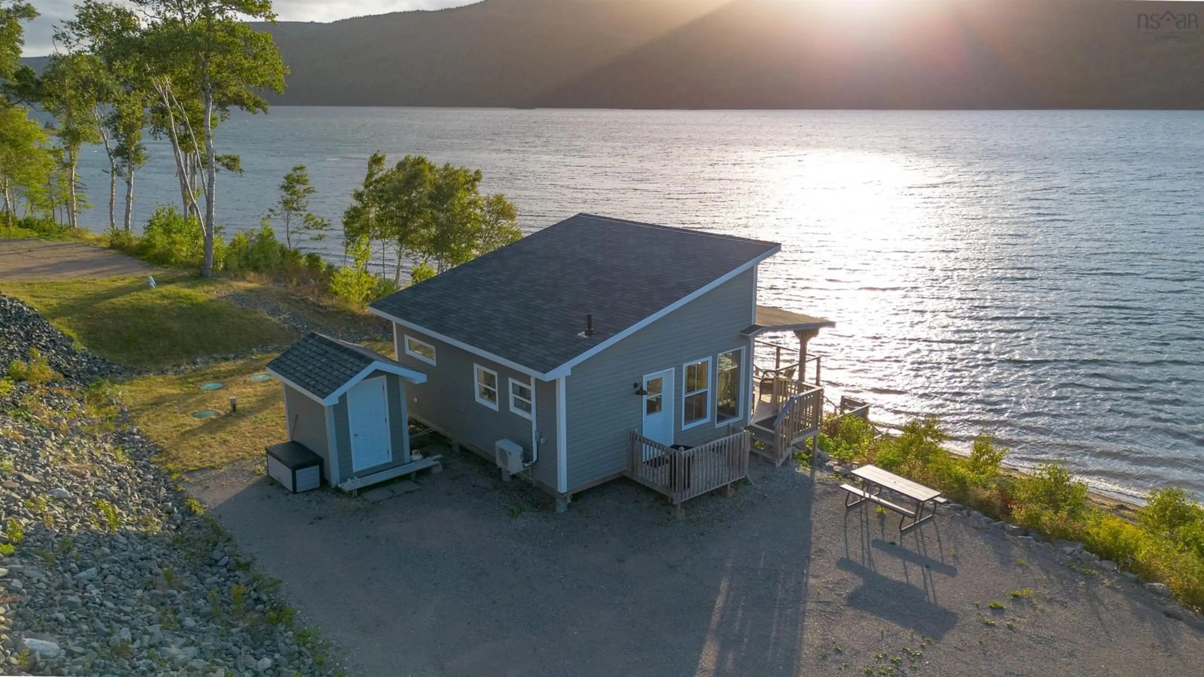 A pic from outside/outdoor area/front of a property/back of a property/a pic from drone, water/lake/river/ocean view for 10823 Kempt Head Rd, Boularderie Nova Scotia B1X 1L5